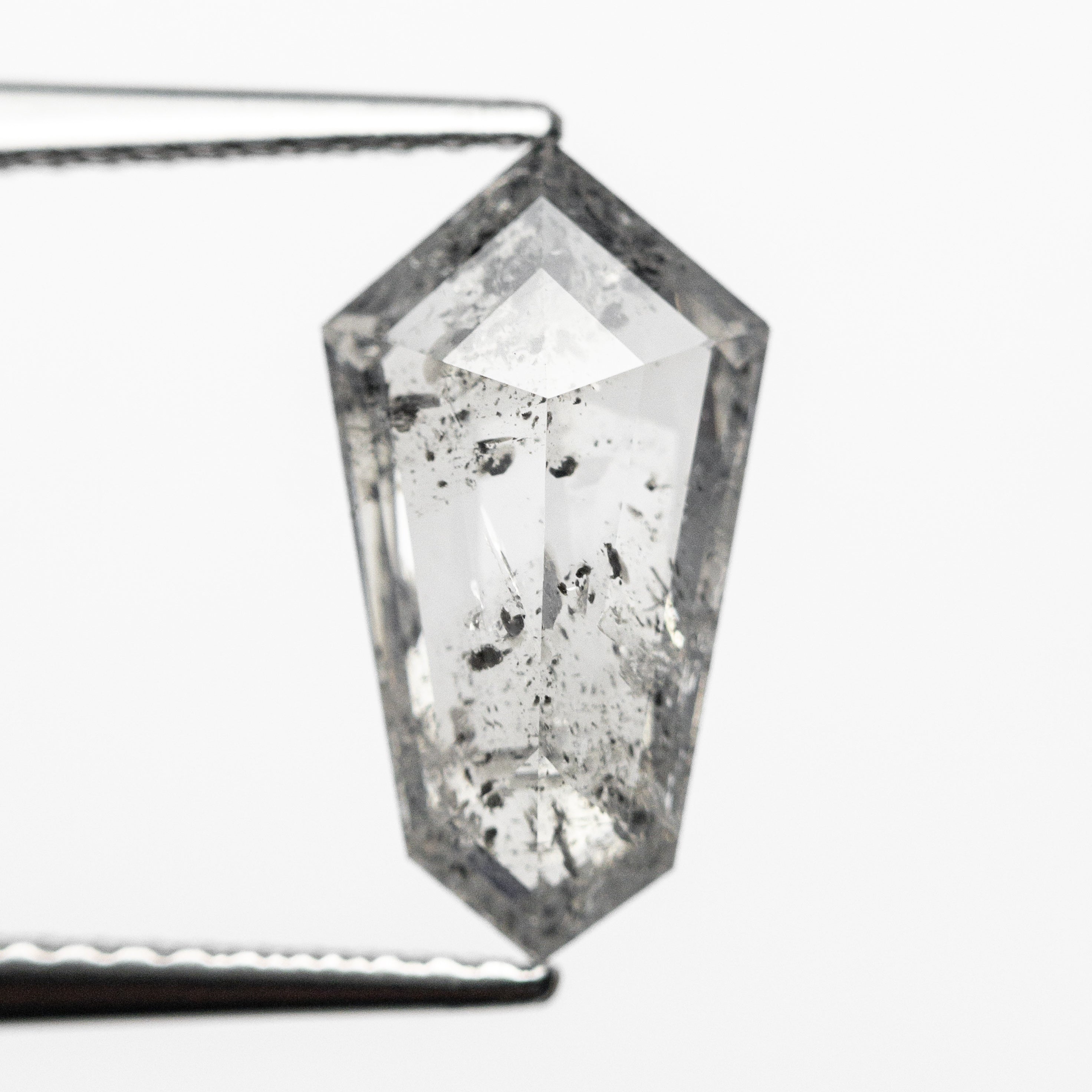 The 1.93ct 12.71x6.95x3.07mm Shield Step Cut 23834-05 by East London jeweller Rachel Boston | Discover our collections of unique and timeless engagement rings, wedding rings, and modern fine jewellery.