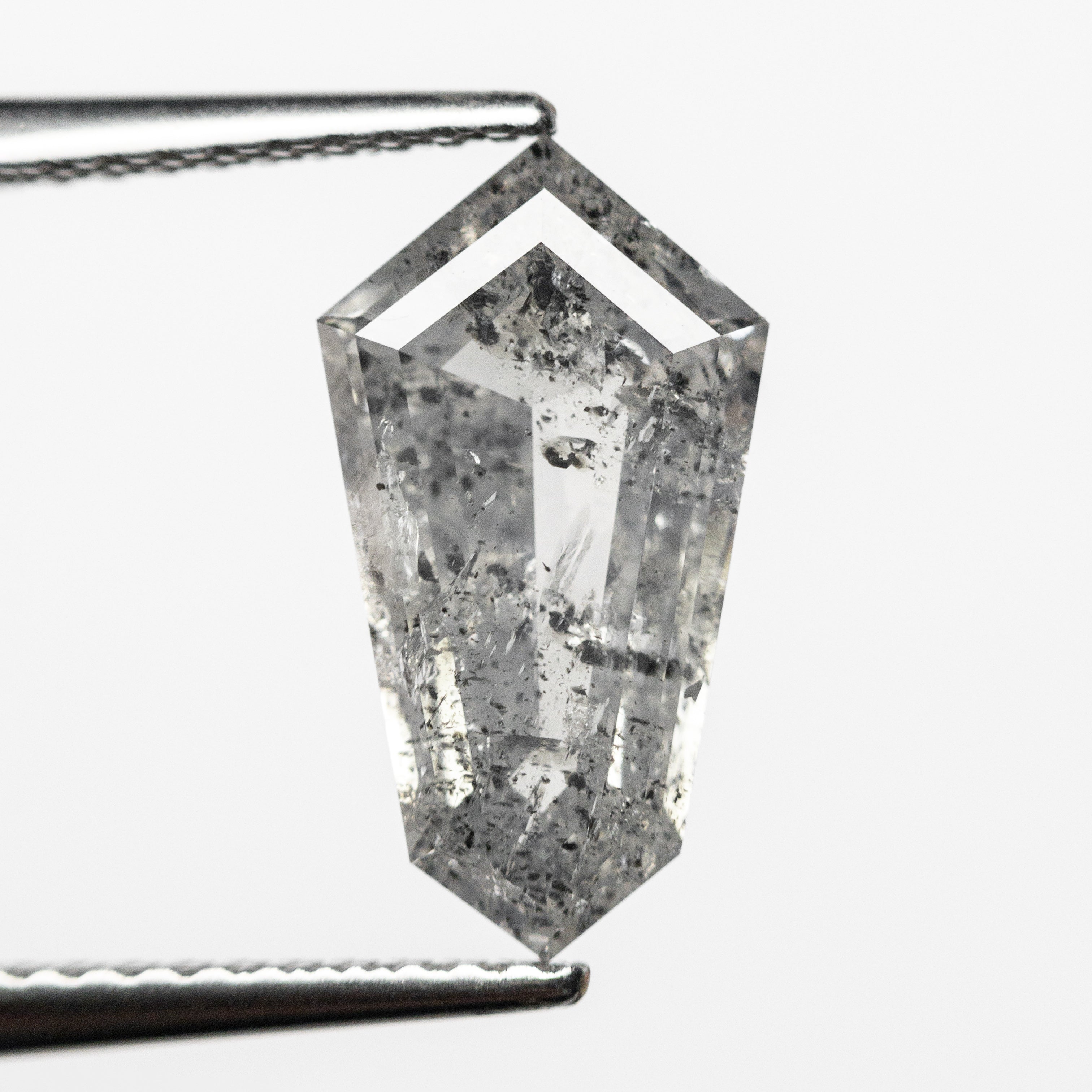 The 1.93ct 12.71x6.95x3.07mm Shield Step Cut 23834-05 by East London jeweller Rachel Boston | Discover our collections of unique and timeless engagement rings, wedding rings, and modern fine jewellery.