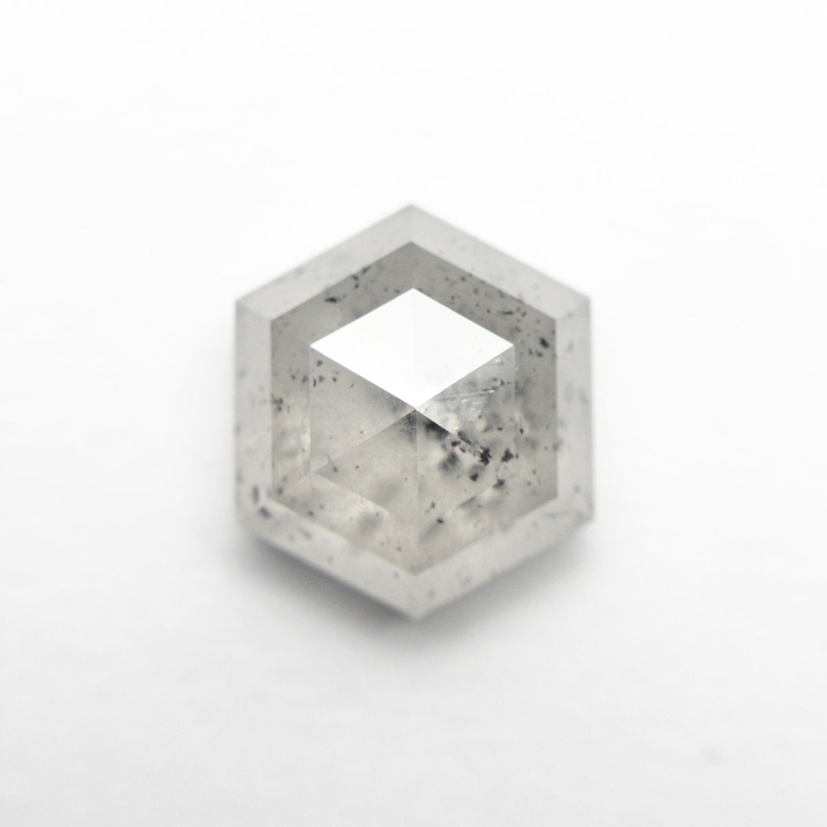 The 3.59ct 9.88x8.59x4.71mm Hexagon Step Cut 23841-08 by East London jeweller Rachel Boston | Discover our collections of unique and timeless engagement rings, wedding rings, and modern fine jewellery.