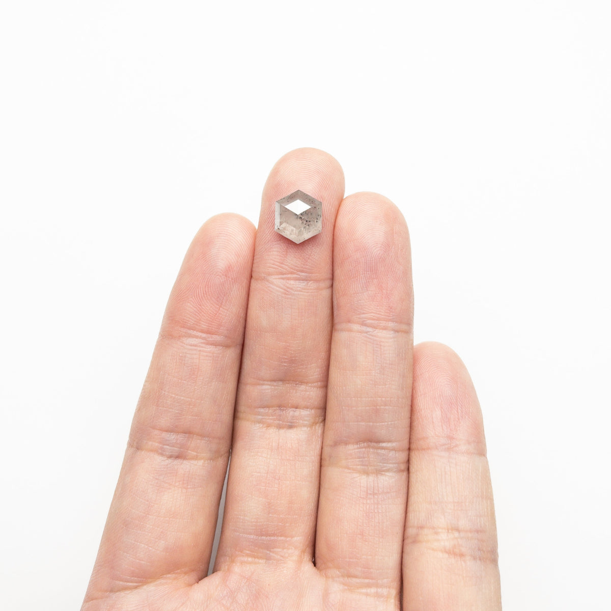 The 3.59ct 9.88x8.59x4.71mm Hexagon Step Cut 23841-08 by East London jeweller Rachel Boston | Discover our collections of unique and timeless engagement rings, wedding rings, and modern fine jewellery.