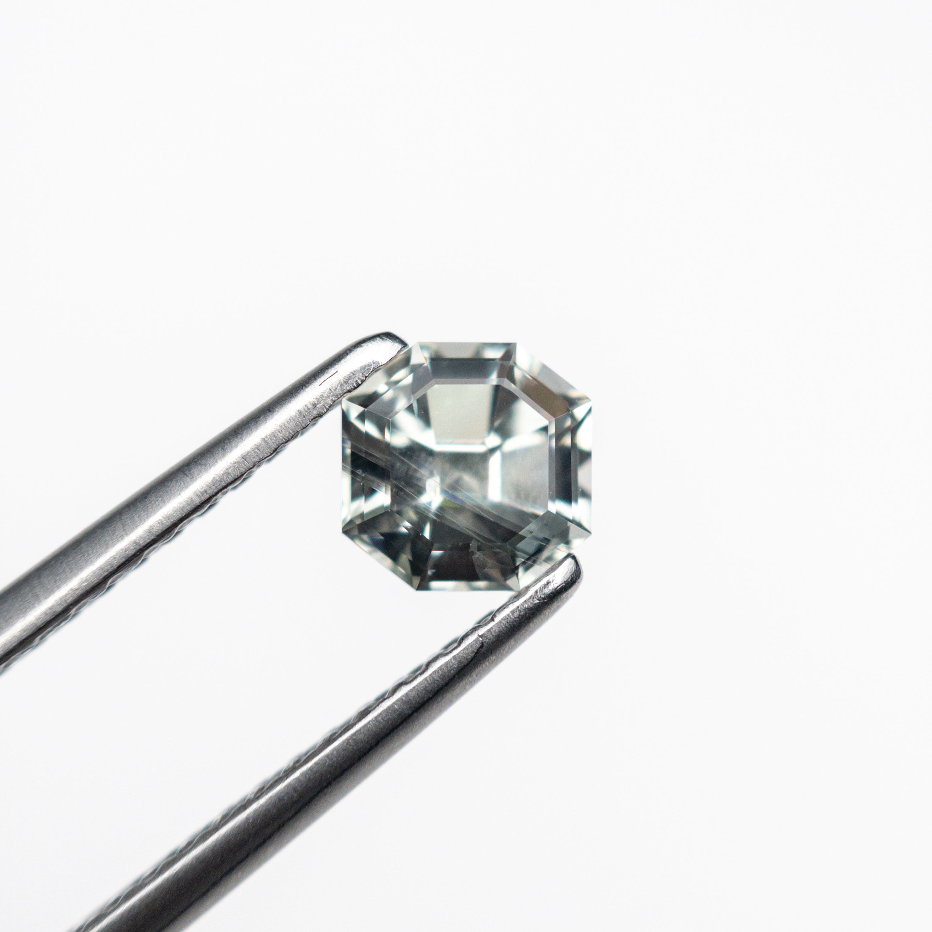 The 0.83ct 5.02x4.98x4.08mm Cut Corner Square Step Cut Sapphire 23903-08 by East London jeweller Rachel Boston | Discover our collections of unique and timeless engagement rings, wedding rings, and modern fine jewellery.