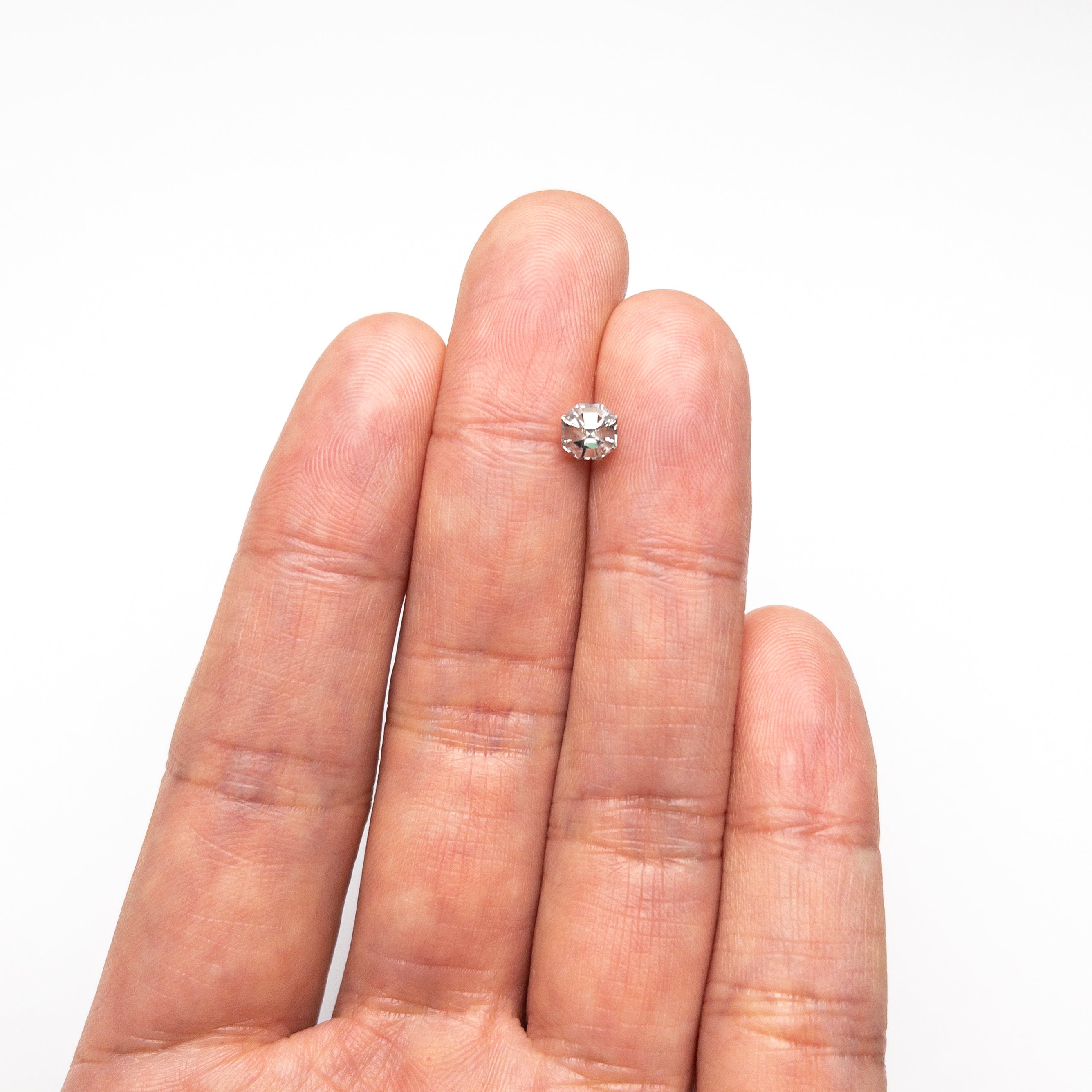 The 0.83ct 5.02x4.98x4.08mm Cut Corner Square Step Cut Sapphire 23903-08 by East London jeweller Rachel Boston | Discover our collections of unique and timeless engagement rings, wedding rings, and modern fine jewellery.