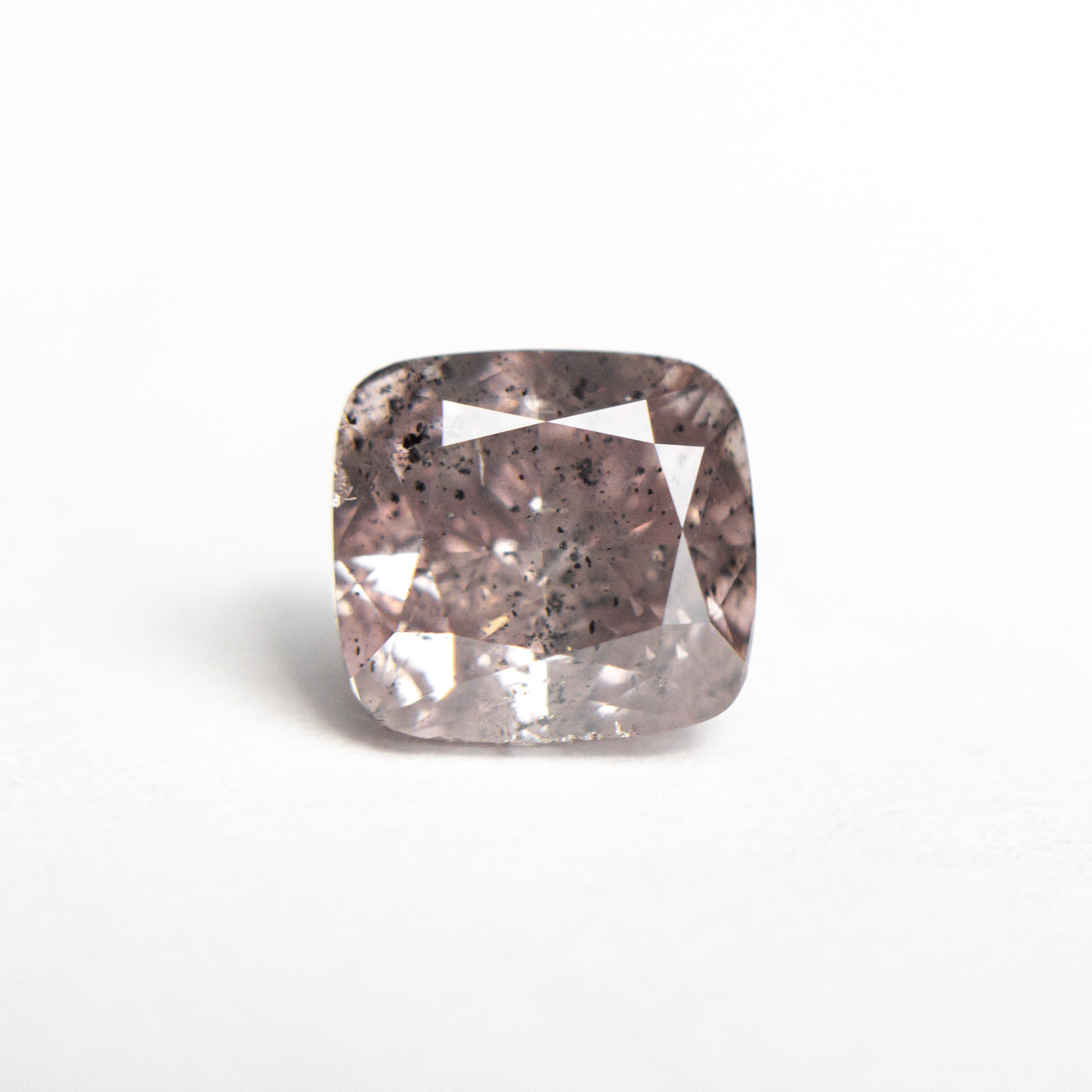 The 2.03ct 7.11x6.65x4.61mm GIA I2 Fancy Brownish Purplish Pink Cushion Brilliant 23911-01 by East London jeweller Rachel Boston | Discover our collections of unique and timeless engagement rings, wedding rings, and modern fine jewellery.