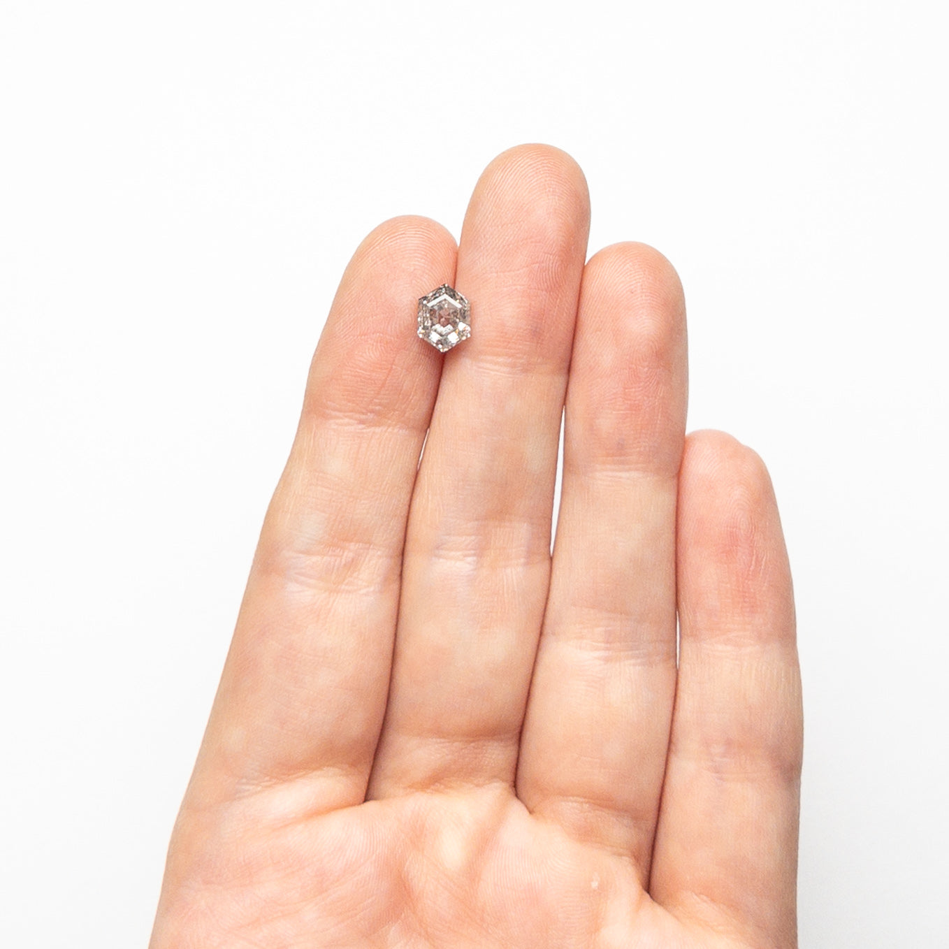 The 1.38ct 7.31x5.59x3.97mm Hexagon Step Cut 🇨🇦 23979-01 by East London jeweller Rachel Boston | Discover our collections of unique and timeless engagement rings, wedding rings, and modern fine jewellery.