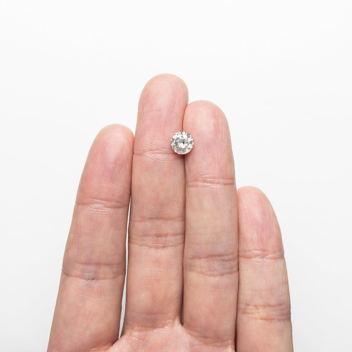 The 1.43ct 6.77x6.74x4.69mm Round Brilliant 🇨🇦 23984-01 by East London jeweller Rachel Boston | Discover our collections of unique and timeless engagement rings, wedding rings, and modern fine jewellery.