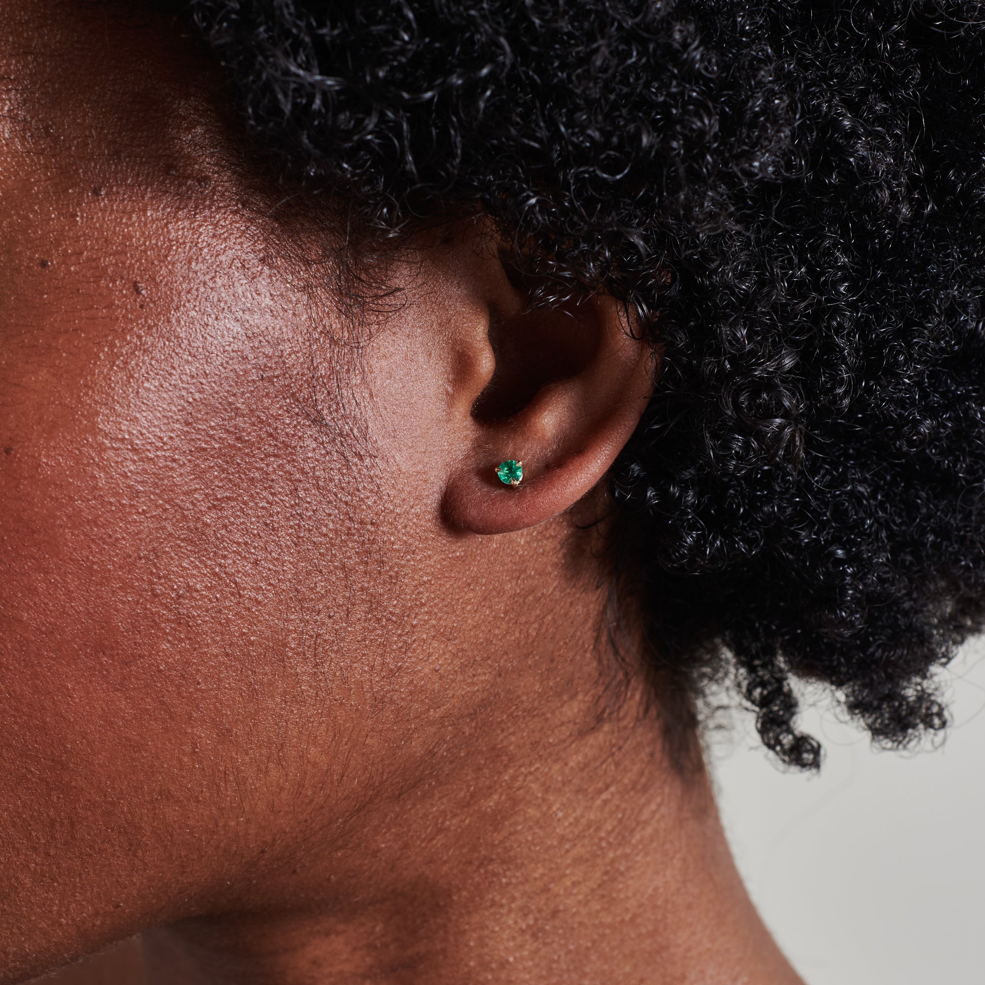 The 3mm Round Emerald Stud Earrings by East London jeweller Rachel Boston | Discover our collections of unique and timeless engagement rings, wedding rings, and modern fine jewellery.