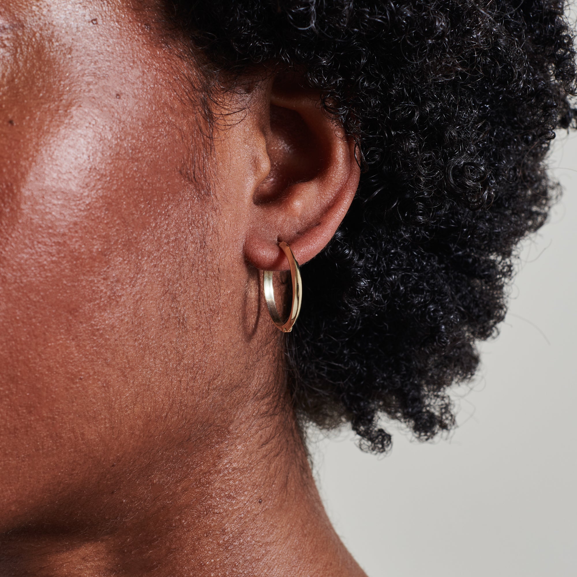 The 20mm Knife Edge Hoop Earrings by East London jeweller Rachel Boston | Discover our collections of unique and timeless engagement rings, wedding rings, and modern fine jewellery.