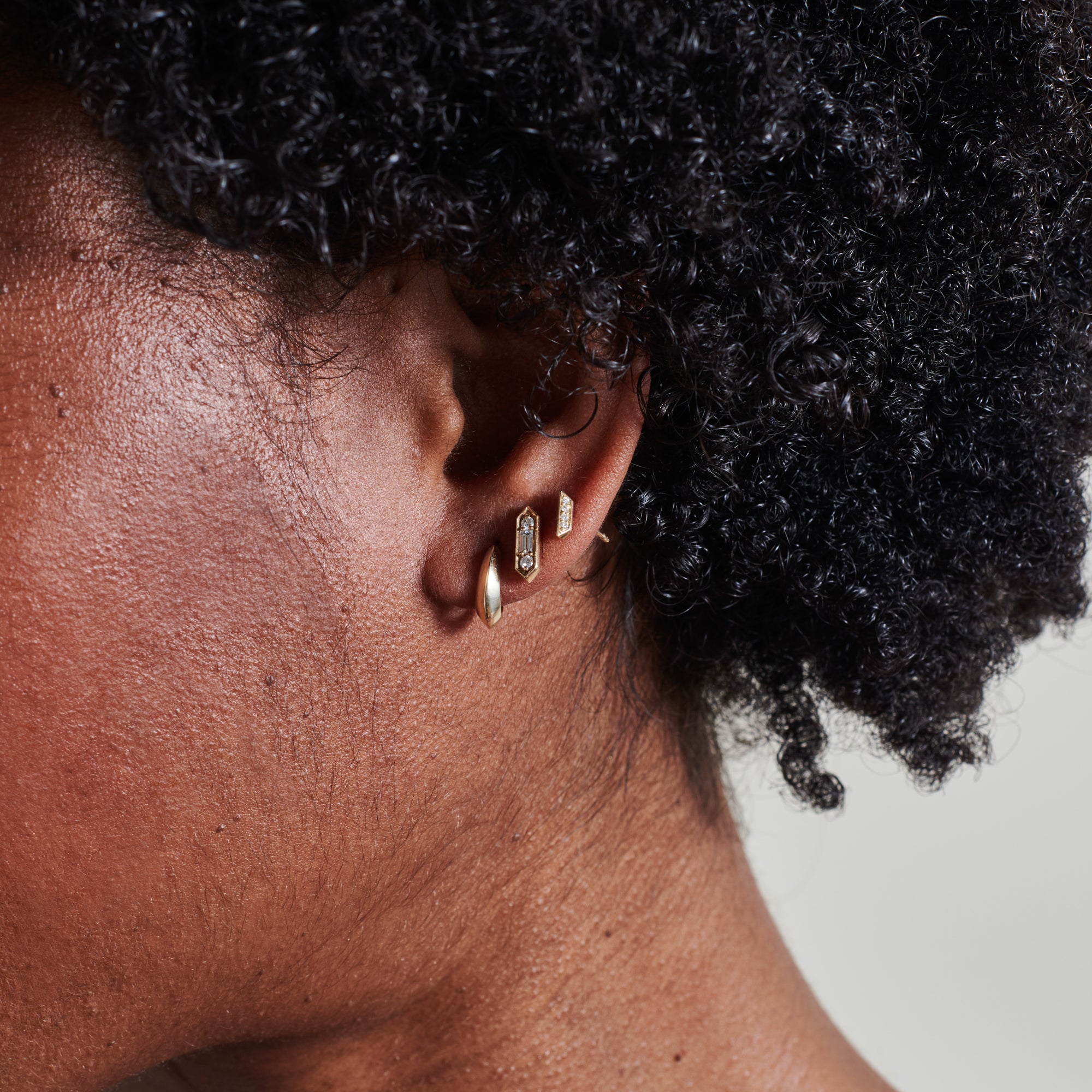 The Baguette & Round Diamond Stud Earrings by East London jeweller Rachel Boston | Discover our collections of unique and timeless engagement rings, wedding rings, and modern fine jewellery.