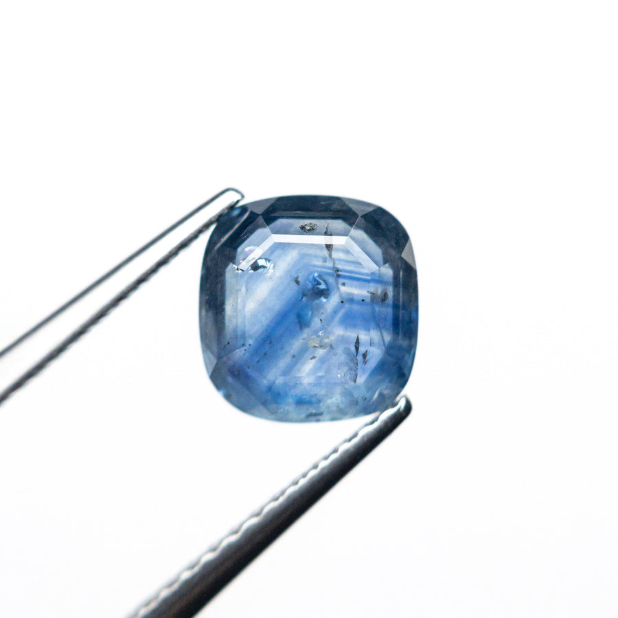 The 1.98ct 7.26x7.01x3.24mm Cushion Portrait Cut Sapphire 24197-02 by East London jeweller Rachel Boston | Discover our collections of unique and timeless engagement rings, wedding rings, and modern fine jewellery. - Rachel Boston Jewellery