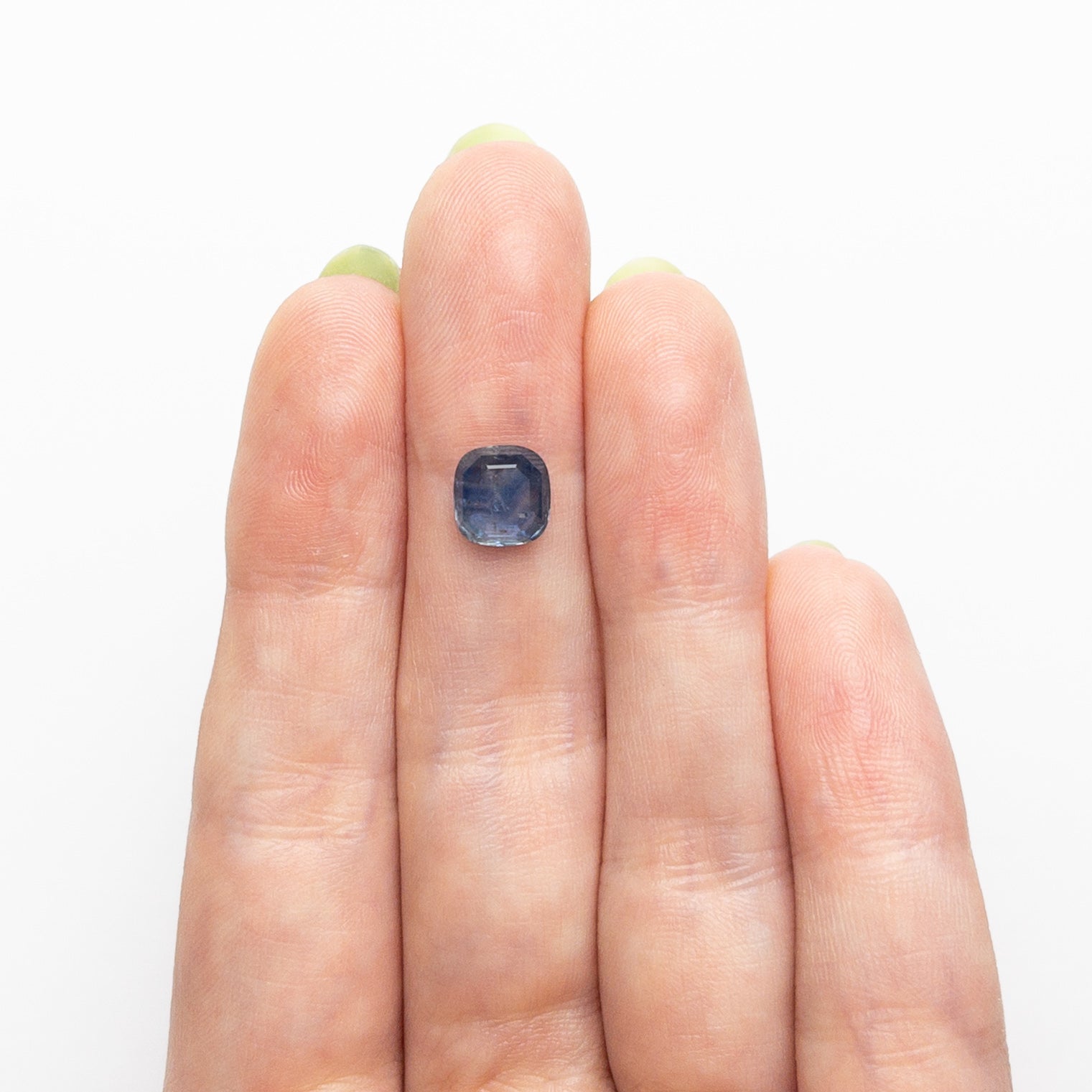 The 1.98ct 7.26x7.01x3.24mm Cushion Portrait Cut Sapphire 24197-02 by East London jeweller Rachel Boston | Discover our collections of unique and timeless engagement rings, wedding rings, and modern fine jewellery.