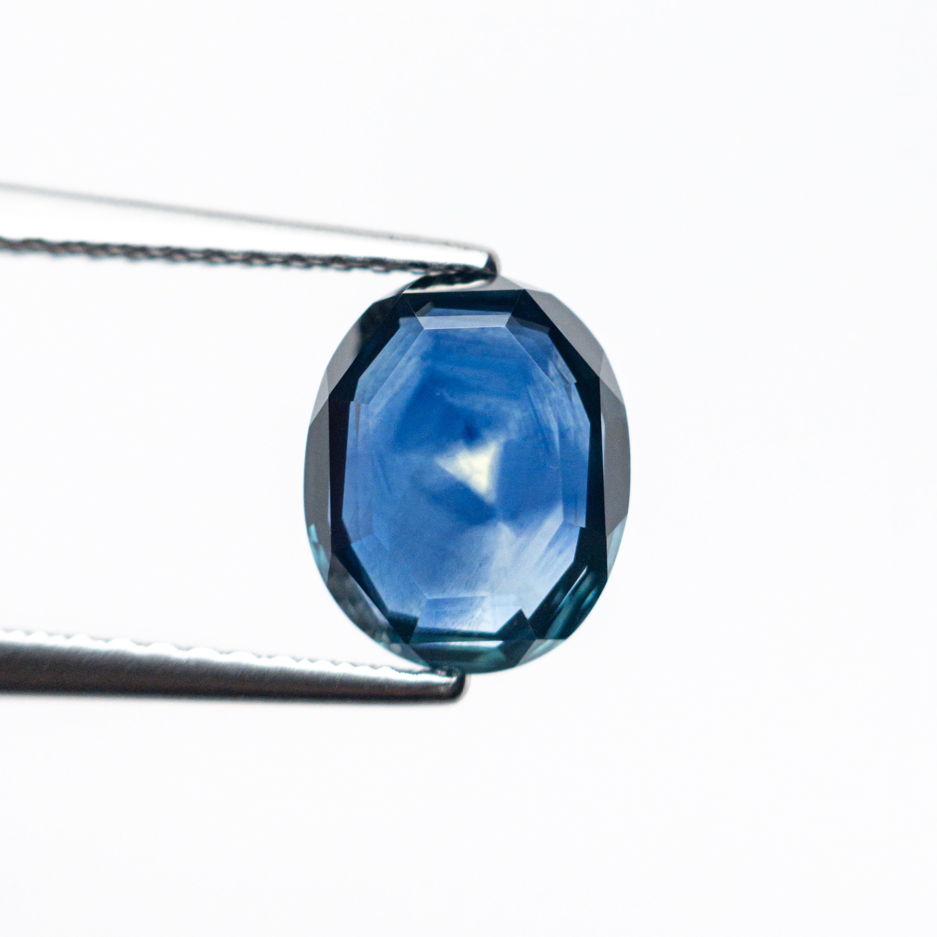 The 1.92ct 8.42x6.83x2.82mm Oval Portrait Cut Sapphire 24197-04 by East London jeweller Rachel Boston | Discover our collections of unique and timeless engagement rings, wedding rings, and modern fine jewellery.