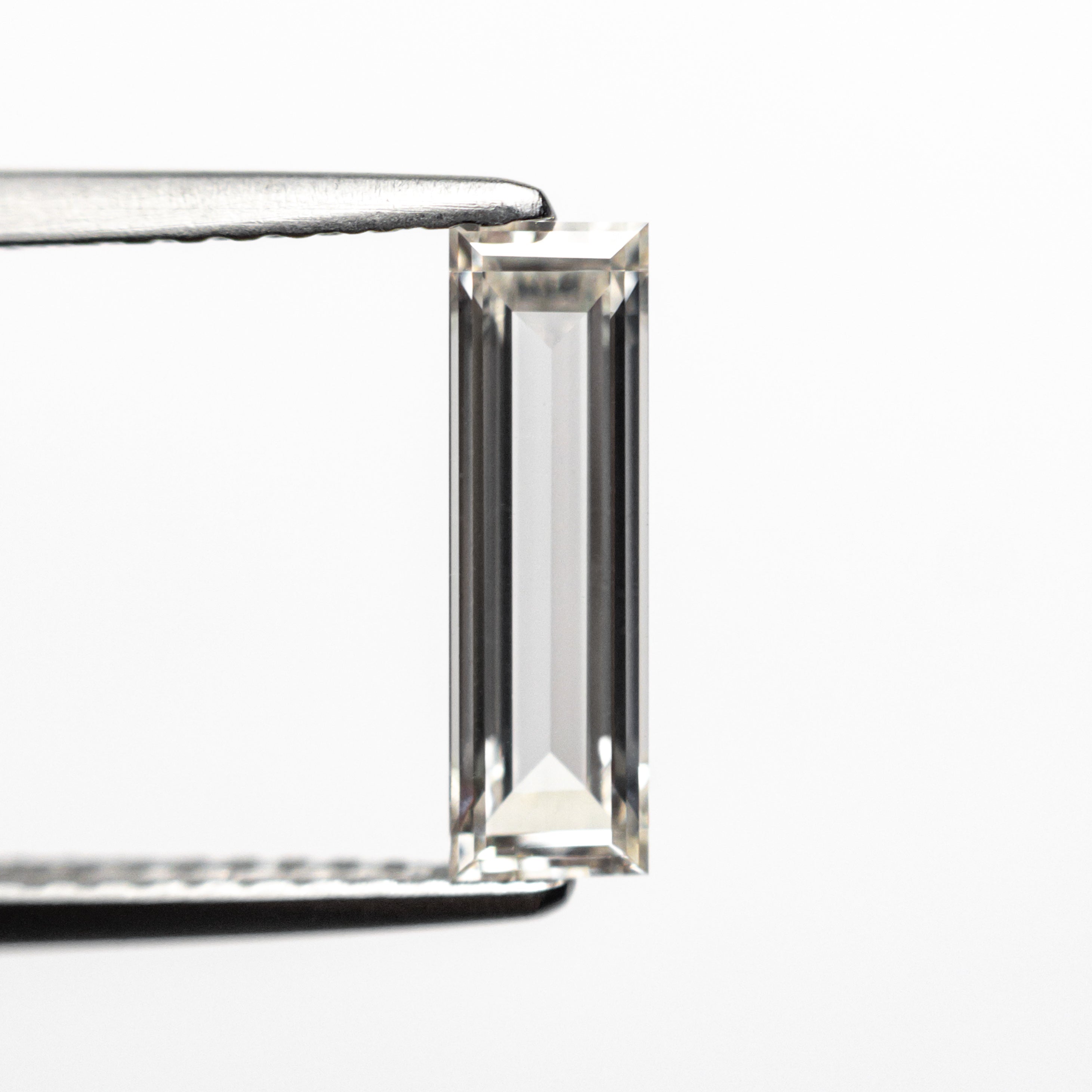 The 0.71ct 10.48x3.17x1.86mm GIA Internally Flawless I Baguette Step Cut 24302-01 by East London jeweller Rachel Boston | Discover our collections of unique and timeless engagement rings, wedding rings, and modern fine jewellery.