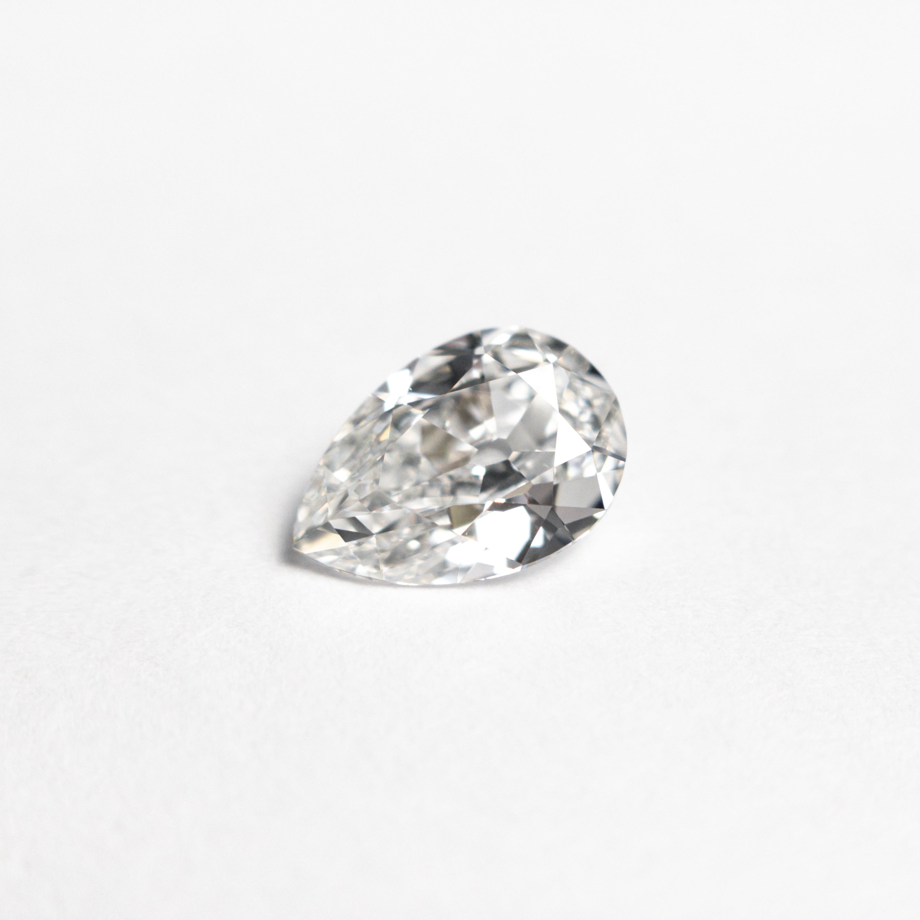 The 0.71ct 7.35x5.03x2.77mm GIA VVS1 F Pear Brilliant 24447-01 by East London jeweller Rachel Boston | Discover our collections of unique and timeless engagement rings, wedding rings, and modern fine jewellery.