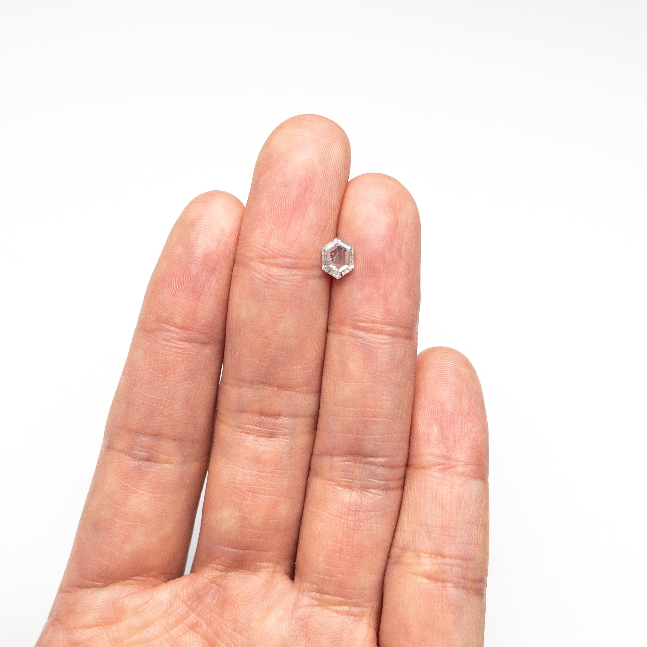 The 0.86ct 6.71x5.11x2.89mm Hexagon Step Cut 🇨🇦 24588-01 by East London jeweller Rachel Boston | Discover our collections of unique and timeless engagement rings, wedding rings, and modern fine jewellery.