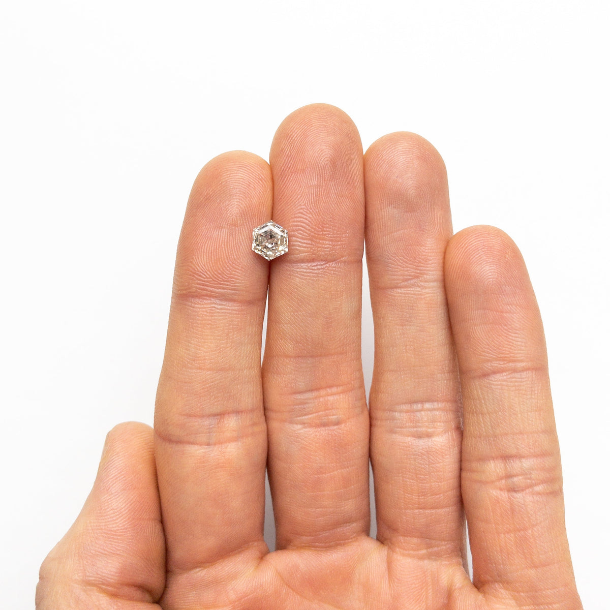 The 1.40ct 7.01x5.98x4.32mm Hexagon Step Cut 🇨🇦 24605-01 by East London jeweller Rachel Boston | Discover our collections of unique and timeless engagement rings, wedding rings, and modern fine jewellery.