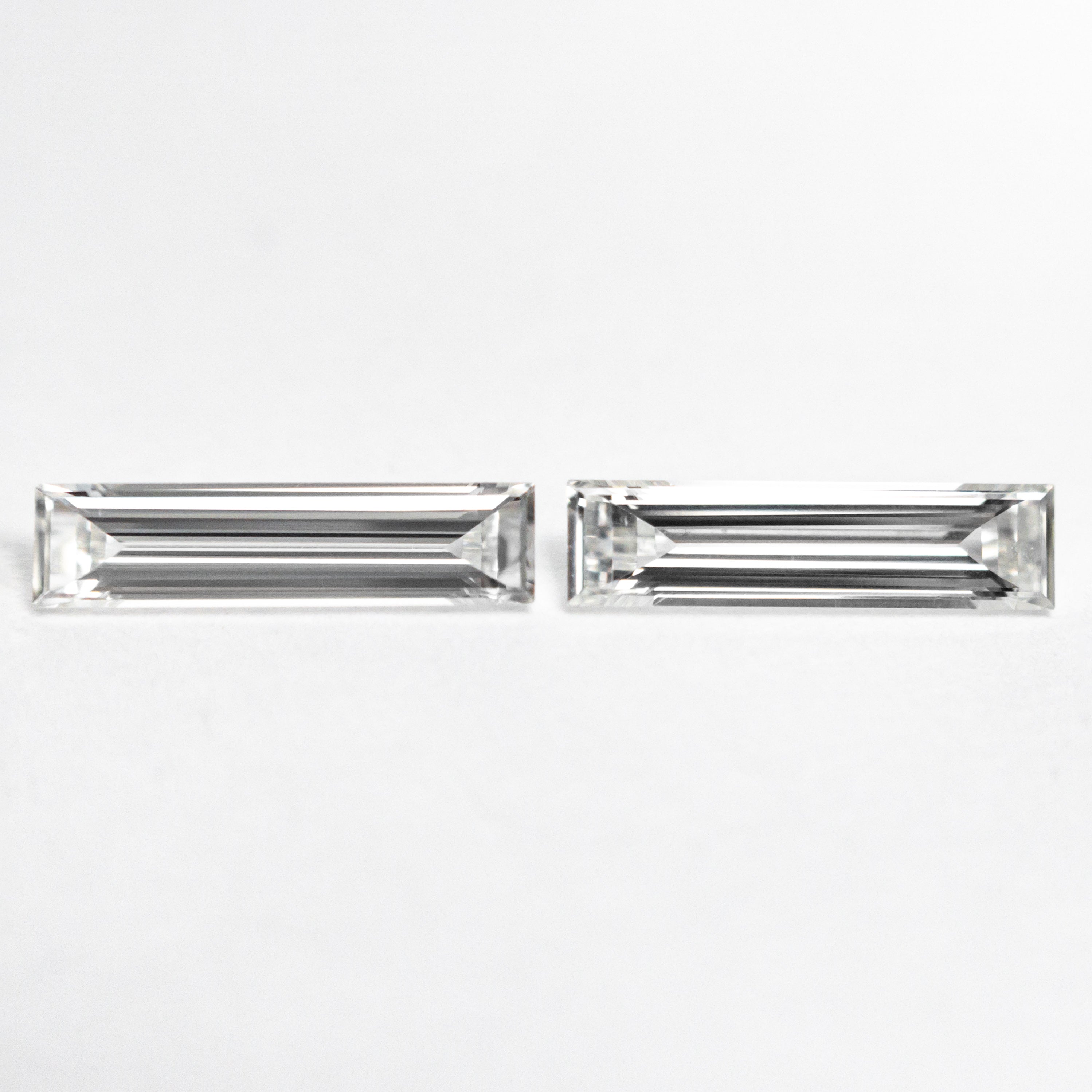 The 0.43cttw 2pc 8.07x1.98x1.22mm 8.07x2.05x1.29mm VS G Baguette Step Cut Matching Pair 24701-01 by East London jeweller Rachel Boston | Discover our collections of unique and timeless engagement rings, wedding rings, and modern fine jewellery.
