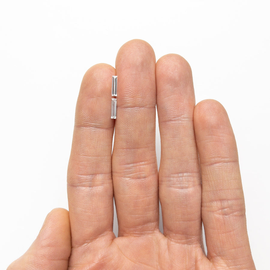 The 0.42cttw 2pc 8.02x2.05x1.22mm 8.03x2.06x1.15mm Baguette Step Cut Matching Pair 24701-03 by East London jeweller Rachel Boston | Discover our collections of unique and timeless engagement rings, wedding rings, and modern fine jewellery. - Rachel Boston Jewellery