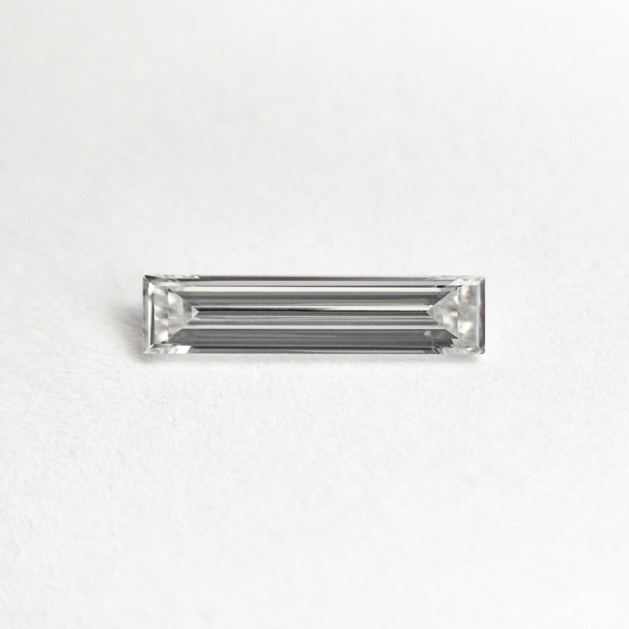 The 0.25ct 9.05x2.06x1.24mm VS1 E Baguette Step Cut 24701-07 by East London jeweller Rachel Boston | Discover our collections of unique and timeless engagement rings, wedding rings, and modern fine jewellery. - Rachel Boston Jewellery