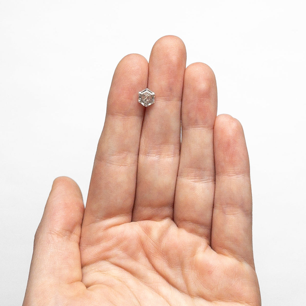 The 1.23ct 6.95x5.93x3.99mm Hexagon Step Cut 🇨🇦 24911-01 by East London jeweller Rachel Boston | Discover our collections of unique and timeless engagement rings, wedding rings, and modern fine jewellery.