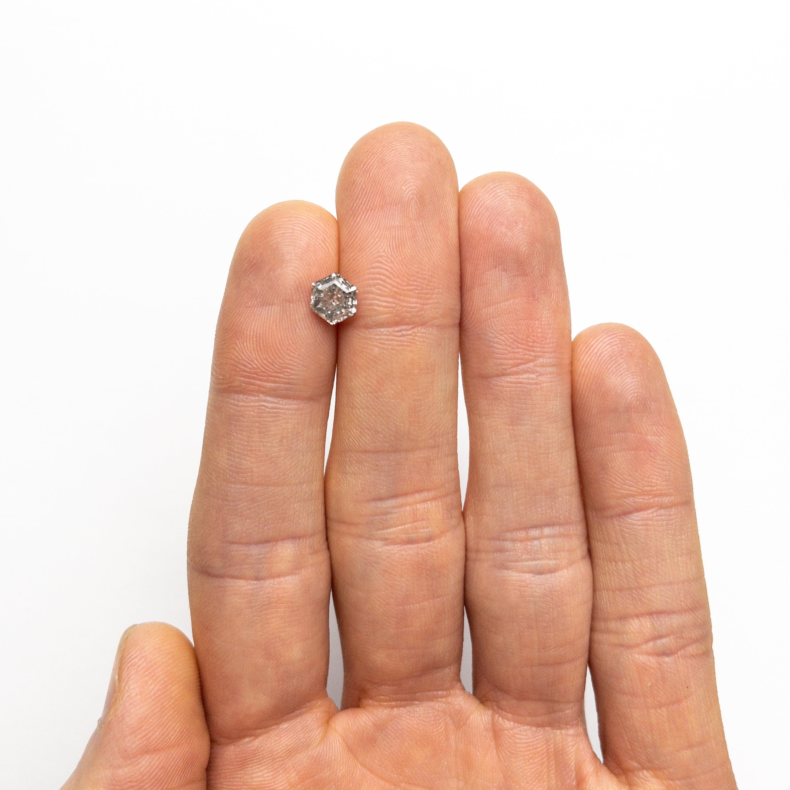 The 1.22ct 6.98x5.91x3.95mm Hexagon Step Cut 🇨🇦 24935-01 by East London jeweller Rachel Boston | Discover our collections of unique and timeless engagement rings, wedding rings, and modern fine jewellery.