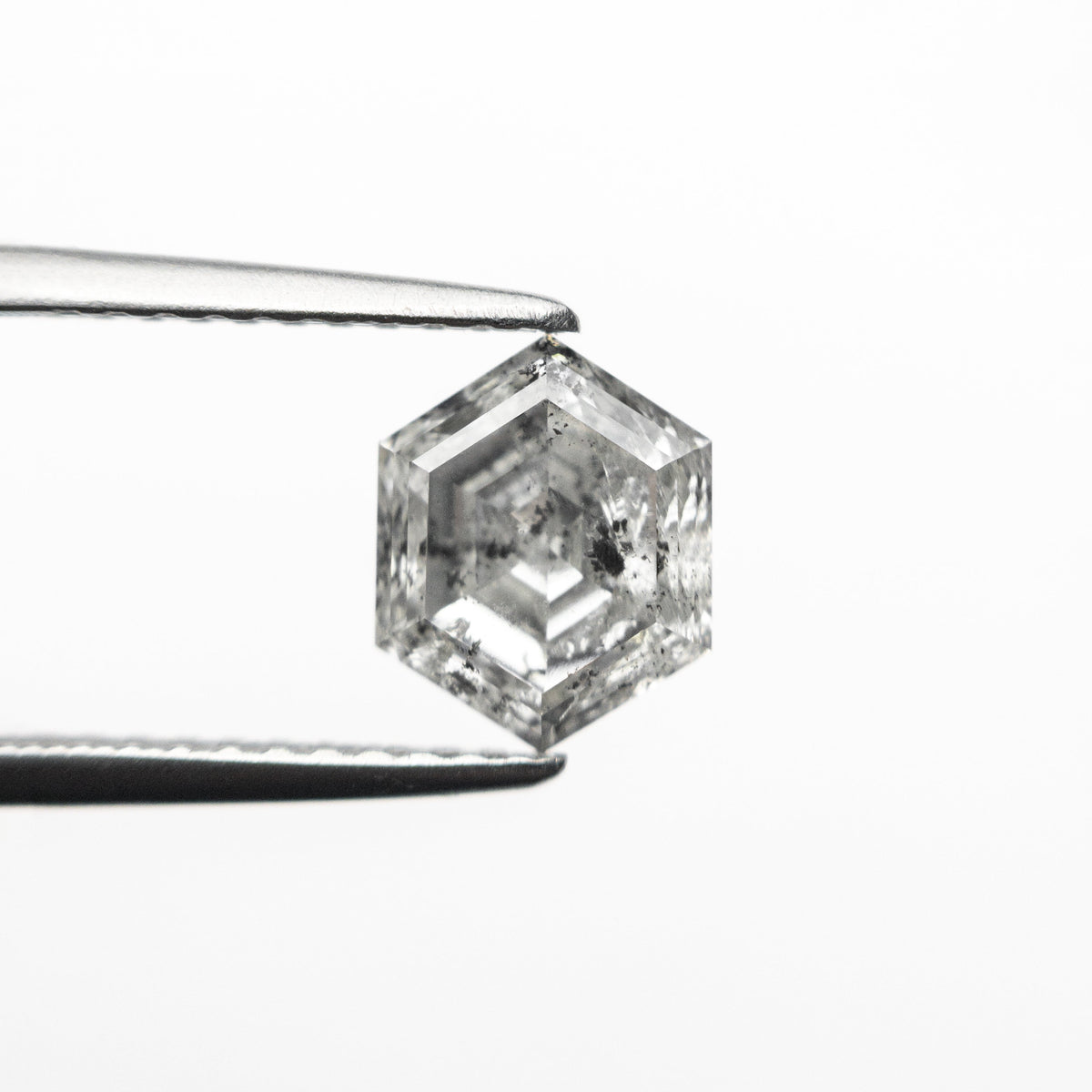 The 1.37ct 7.60x6.11x3.93mm Hexagon Step Cut 🇨🇦 24959-01 by East London jeweller Rachel Boston | Discover our collections of unique and timeless engagement rings, wedding rings, and modern fine jewellery.