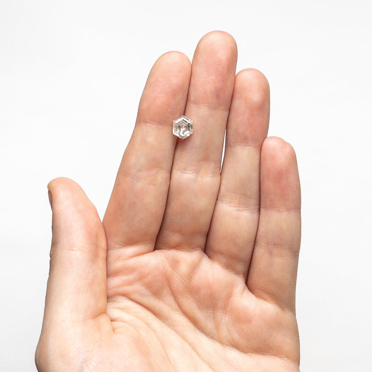 The 1.37ct 7.60x6.11x3.93mm Hexagon Step Cut 🇨🇦 24959-01 by East London jeweller Rachel Boston | Discover our collections of unique and timeless engagement rings, wedding rings, and modern fine jewellery.