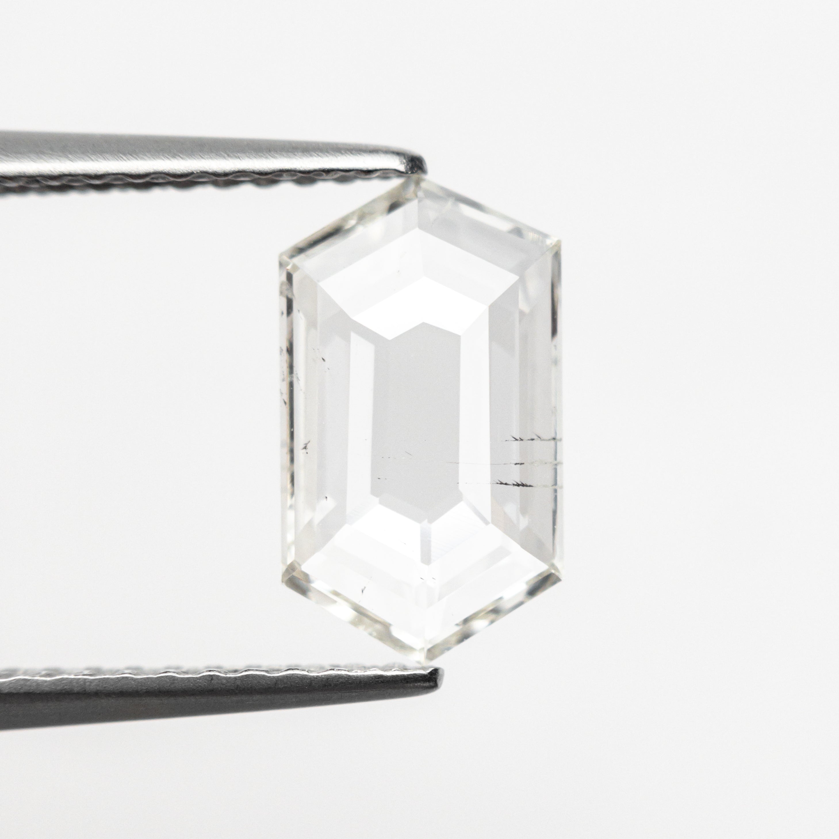 The 0.97ct 10.48x6.04x1.50mm I1 J Hexagon Rosecut 25133-01 by East London jeweller Rachel Boston | Discover our collections of unique and timeless engagement rings, wedding rings, and modern fine jewellery.