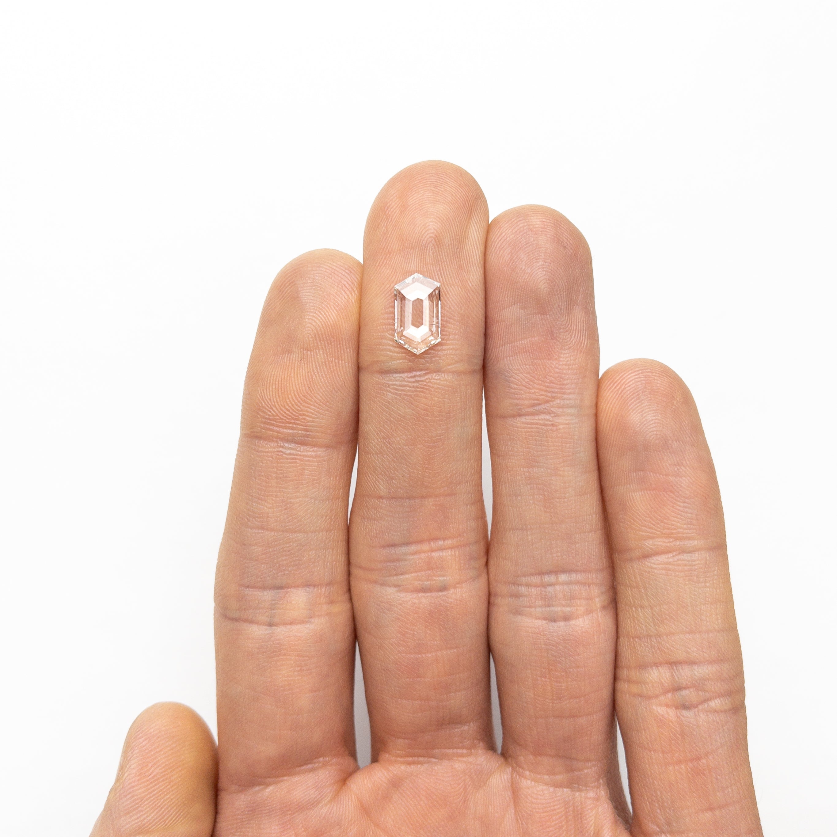 The 0.97ct 10.48x6.04x1.50mm I1 J Hexagon Rosecut 25133-01 by East London jeweller Rachel Boston | Discover our collections of unique and timeless engagement rings, wedding rings, and modern fine jewellery.