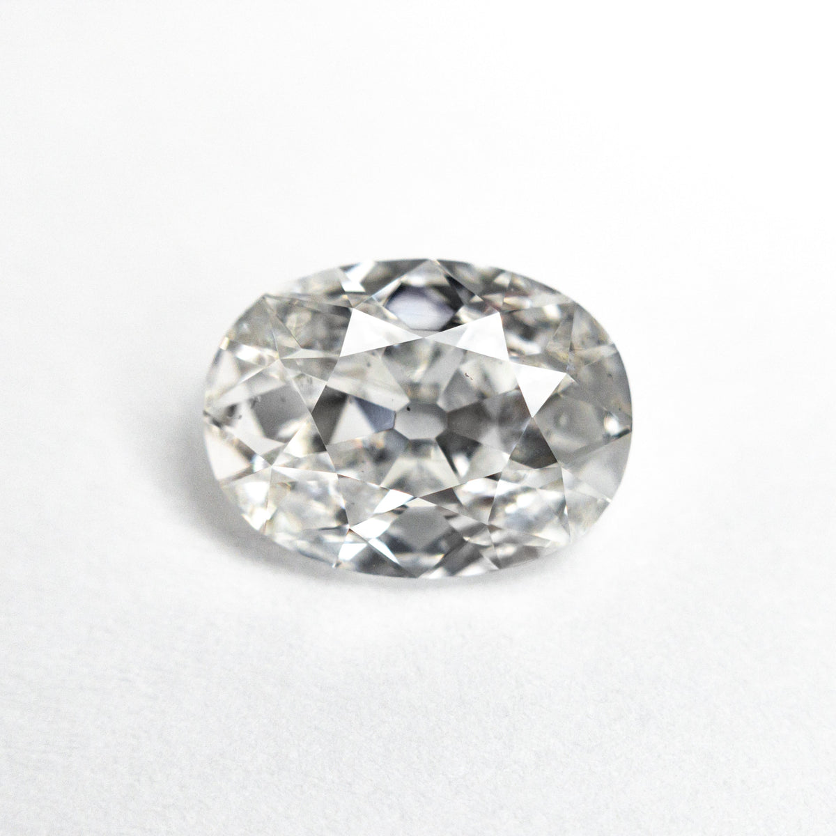 The 2.01ct 9.42x7.04x3.90mm GIA SI1 E Modern Antique Oval Brilliant 25159-01 by East London jeweller Rachel Boston | Discover our collections of unique and timeless engagement rings, wedding rings, and modern fine jewellery.