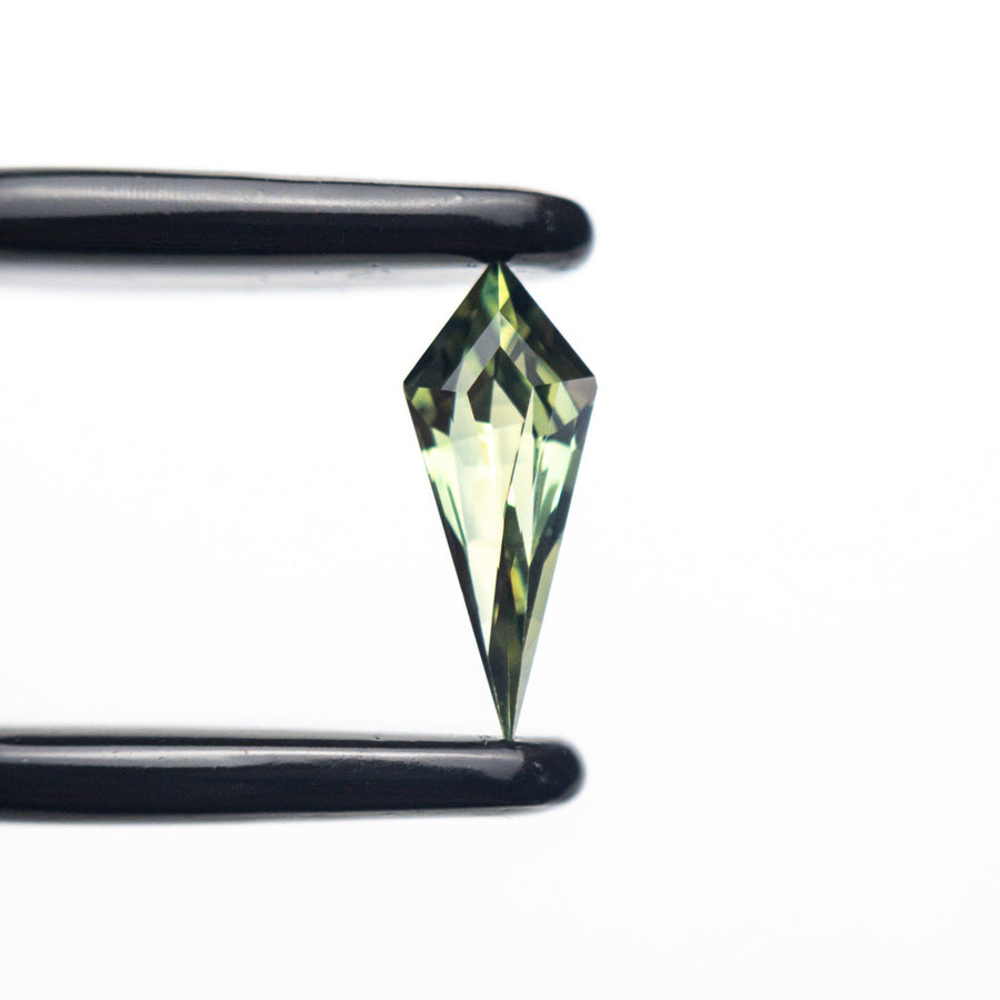 The 0.42ct 9.15x3.66x2.66mm Kite Step Cut Sapphire 25196-01 by East London jeweller Rachel Boston | Discover our collections of unique and timeless engagement rings, wedding rings, and modern fine jewellery. - Rachel Boston Jewellery