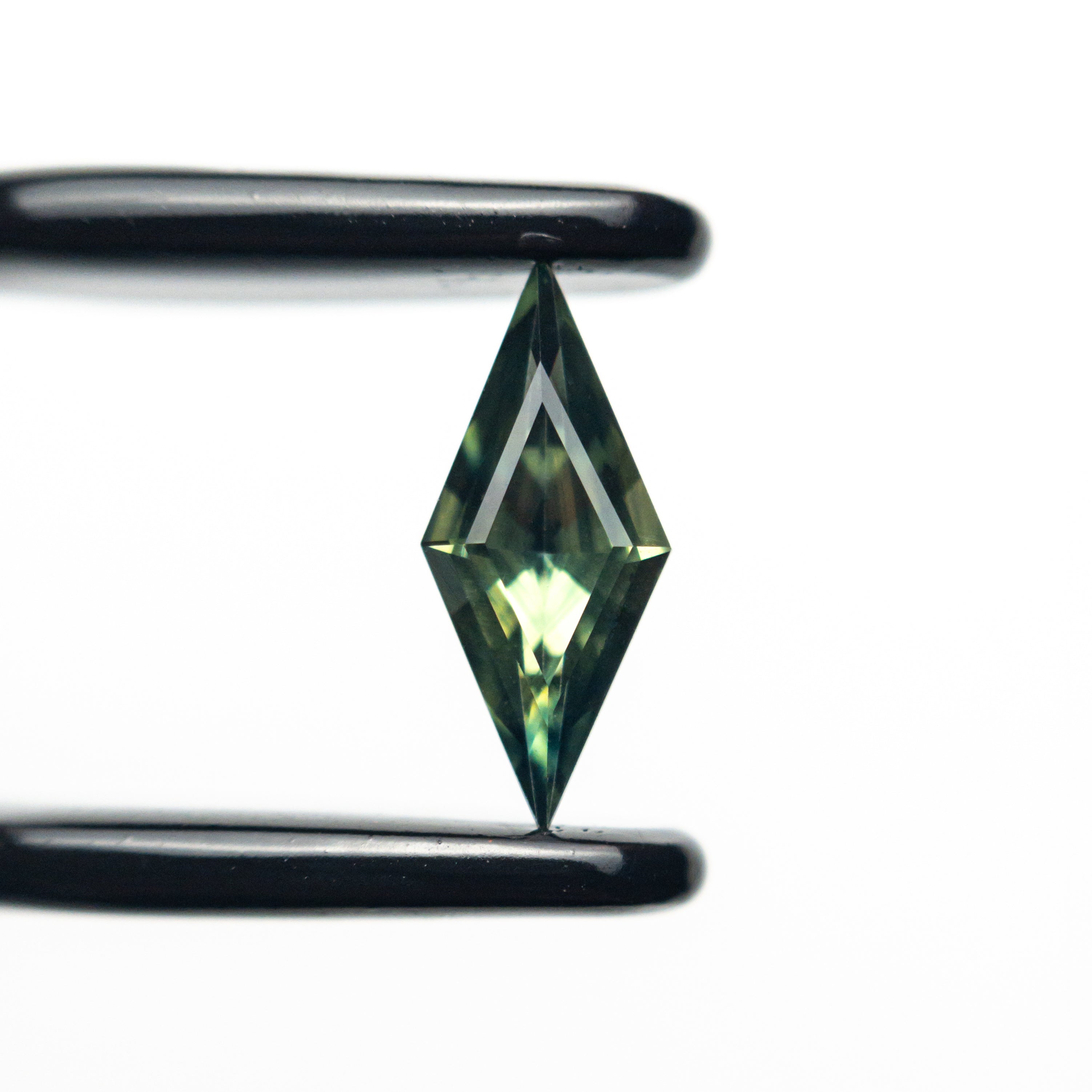 The 0.49ct 9.63x4.21x2.58mm Lozenge Step Cut Sapphire 25197-05 by East London jeweller Rachel Boston | Discover our collections of unique and timeless engagement rings, wedding rings, and modern fine jewellery.