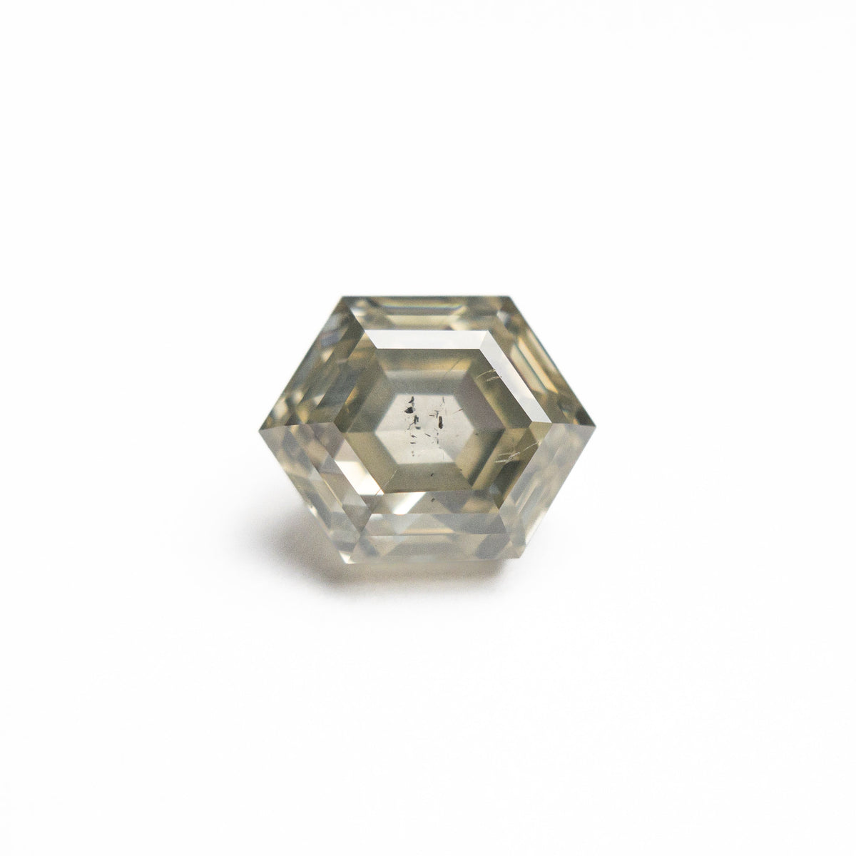 The 1.66ct 7.65x6.06x4.36mm Hexagon Step Cut 25455-04 by East London jeweller Rachel Boston | Discover our collections of unique and timeless engagement rings, wedding rings, and modern fine jewellery.