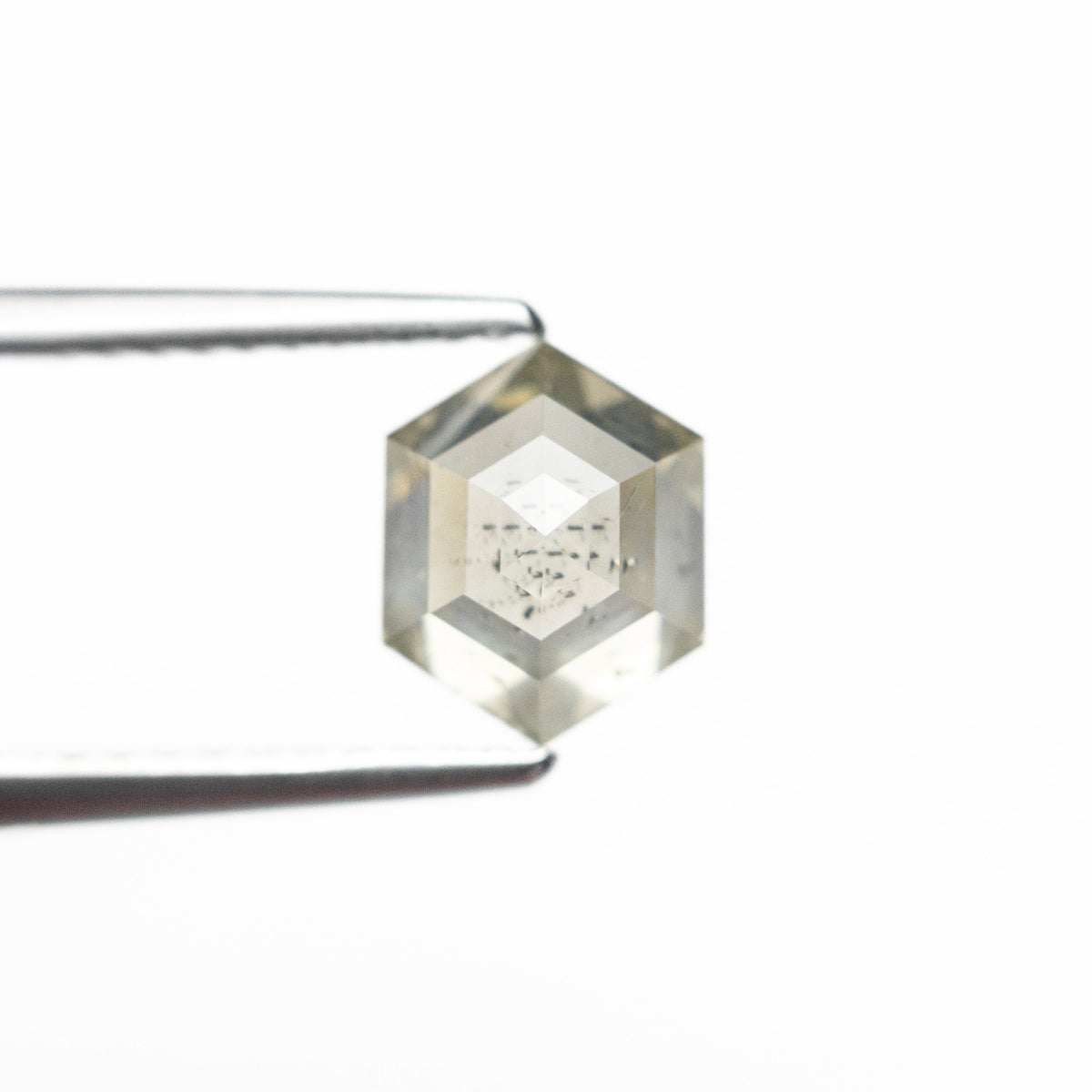 The 1.66ct 7.65x6.06x4.36mm Hexagon Step Cut 25455-04 by East London jeweller Rachel Boston | Discover our collections of unique and timeless engagement rings, wedding rings, and modern fine jewellery.