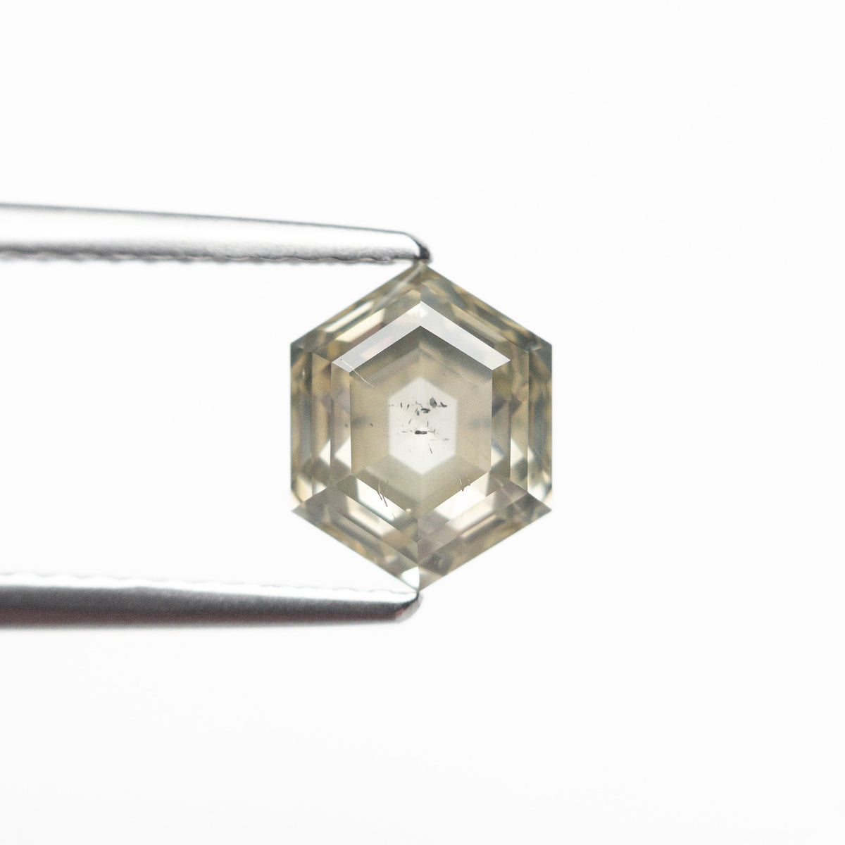 The 1.66ct 7.65x6.06x4.36mm Hexagon Step Cut 25455-04 by East London jeweller Rachel Boston | Discover our collections of unique and timeless engagement rings, wedding rings, and modern fine jewellery.