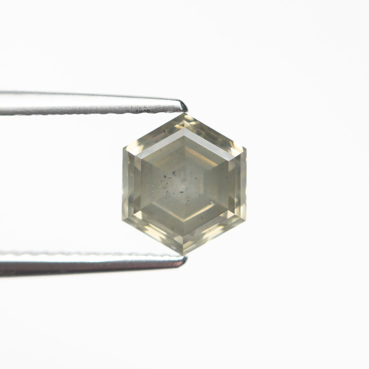 The 1.59ct 7.54x6.54x4.31mm Hexagon Step Cut 25455-10 by East London jeweller Rachel Boston | Discover our collections of unique and timeless engagement rings, wedding rings, and modern fine jewellery.