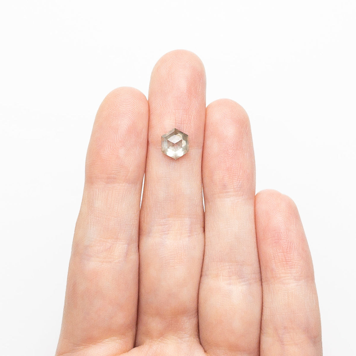 The 1.59ct 7.54x6.54x4.31mm Hexagon Step Cut 25455-10 by East London jeweller Rachel Boston | Discover our collections of unique and timeless engagement rings, wedding rings, and modern fine jewellery.