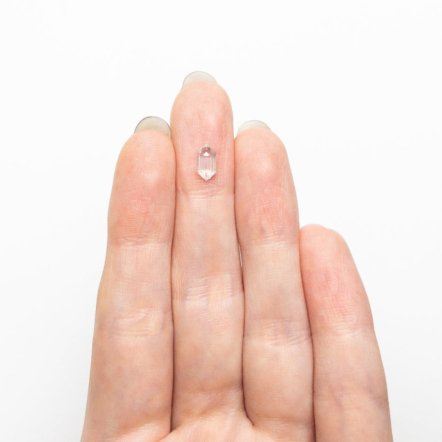The 0.64ct 7.71x4.04x2.26mm Hexagon Step Cut 25457-19 by East London jeweller Rachel Boston | Discover our collections of unique and timeless engagement rings, wedding rings, and modern fine jewellery. - Rachel Boston Jewellery