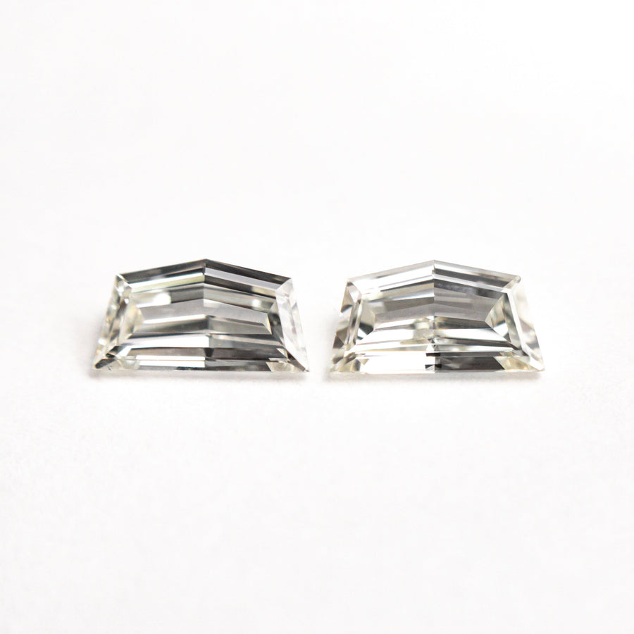 The 0.60cttw 2pc 6.11x3.21x1.68mm 6.11x3.21x1.61mm VS J Epaulette Step Cut Matching Pair 25517-01 by East London jeweller Rachel Boston | Discover our collections of unique and timeless engagement rings, wedding rings, and modern fine jewellery. - Rachel Boston Jewellery