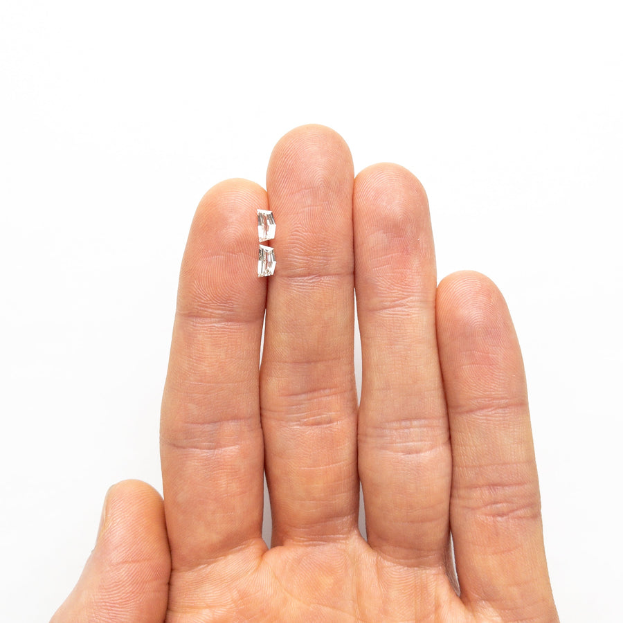 The 0.60cttw 2pc 6.11x3.21x1.68mm 6.11x3.21x1.61mm VS J Epaulette Step Cut Matching Pair 25517-01 by East London jeweller Rachel Boston | Discover our collections of unique and timeless engagement rings, wedding rings, and modern fine jewellery. - Rachel Boston Jewellery