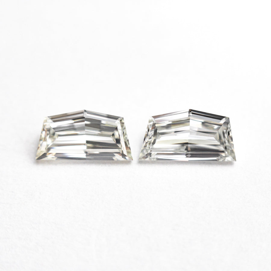 The 0.85cttw 2pc 6.59x3.49x1.90mm 6.56x3.40x2.00mm VVS2/VS1 H-J Epaulette Step Cut Matching Pair 25523-01 by East London jeweller Rachel Boston | Discover our collections of unique and timeless engagement rings, wedding rings, and modern fine jewellery. - Rachel Boston Jewellery
