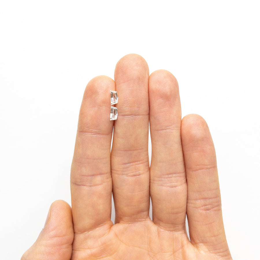 The 0.85cttw 2pc 6.59x3.49x1.90mm 6.56x3.40x2.00mm VVS2/VS1 H-J Epaulette Step Cut Matching Pair 25523-01 by East London jeweller Rachel Boston | Discover our collections of unique and timeless engagement rings, wedding rings, and modern fine jewellery. - Rachel Boston Jewellery