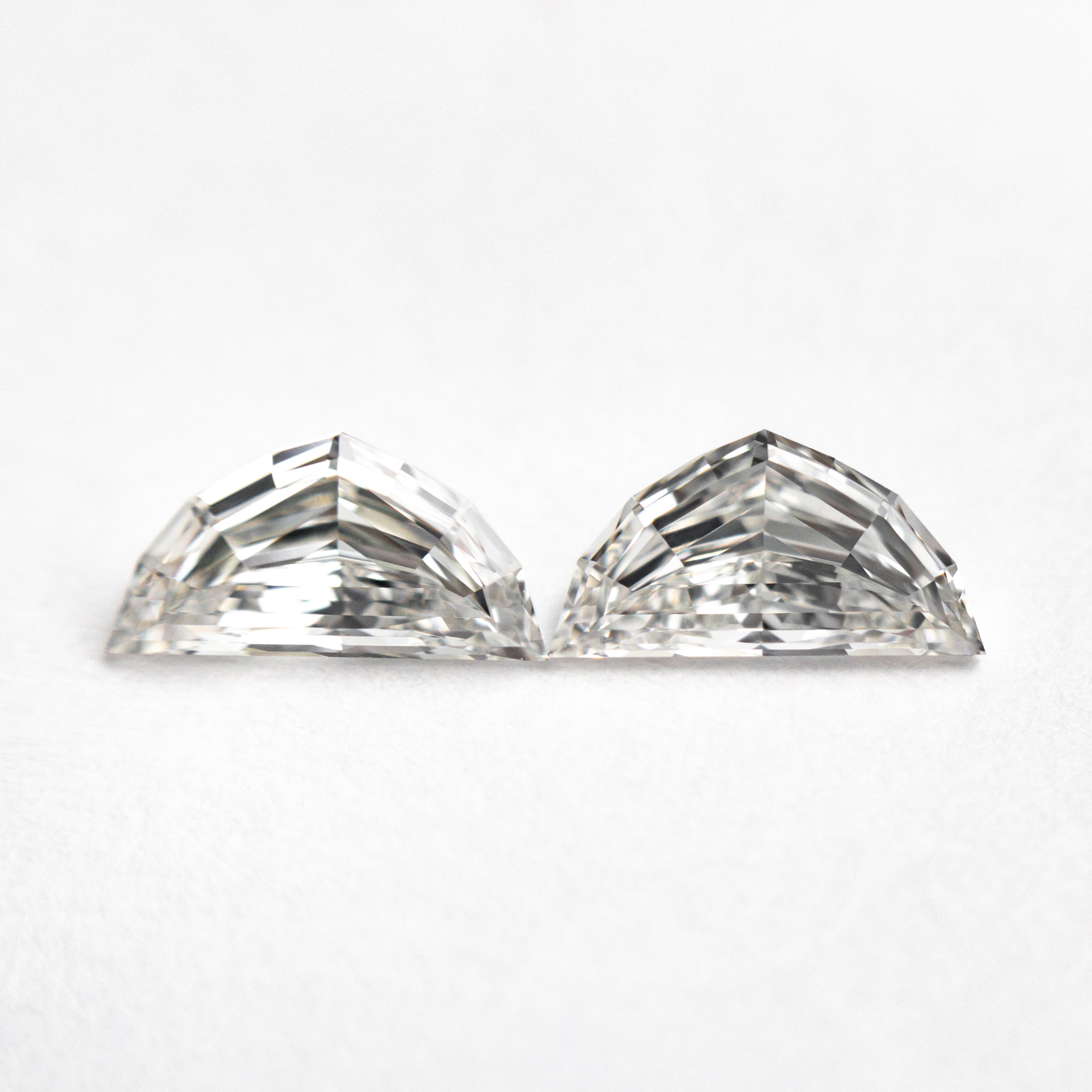 The 0.86cttw 2pc 7.23x3.71x2.28mm 7.23x3.74x2.05mm VVS/VS H Epaulette Step Cut Matching Pair 25525-01 by East London jeweller Rachel Boston | Discover our collections of unique and timeless engagement rings, wedding rings, and modern fine jewellery.
