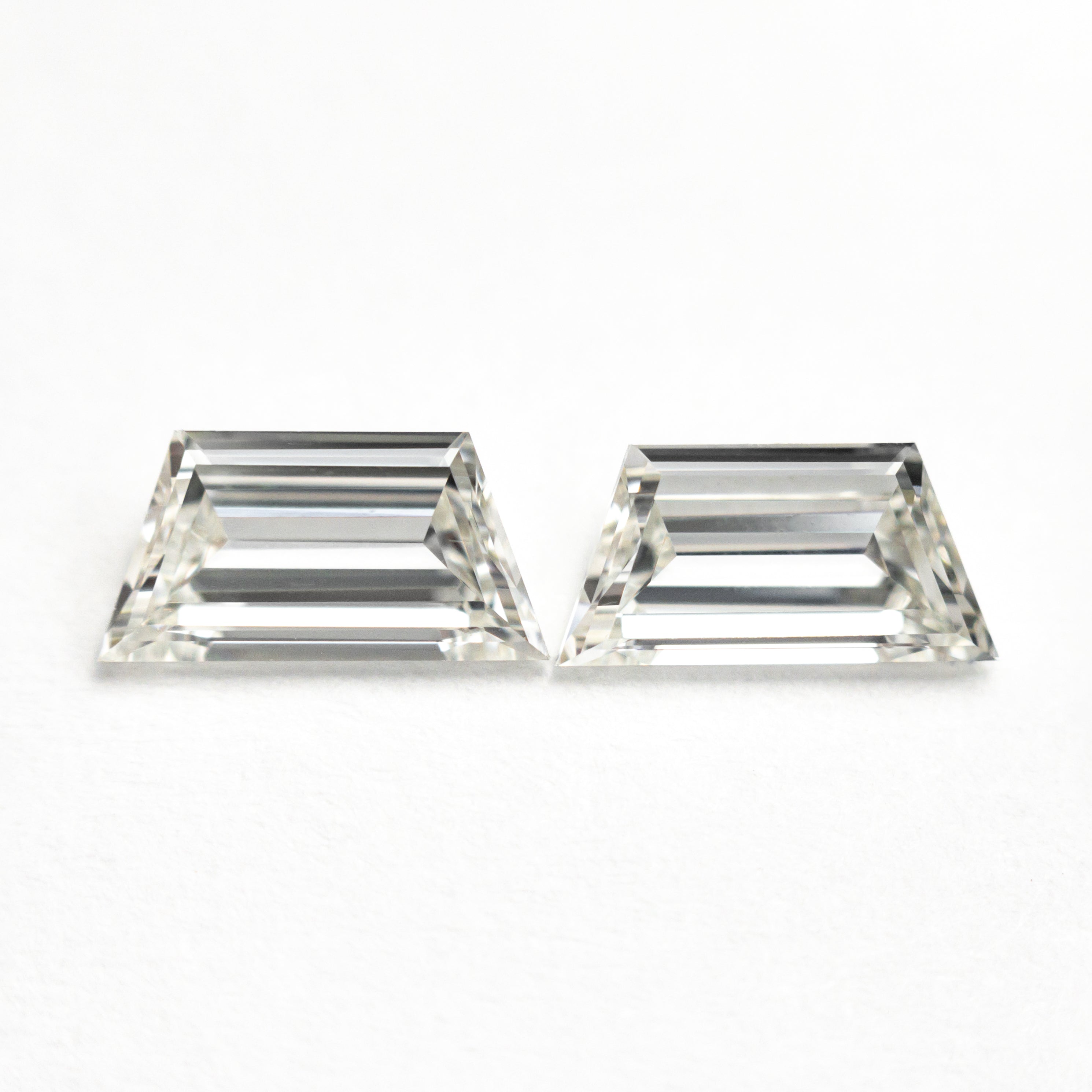 The 1.01cttw 2pc 7.46x3.80x2.00mm 7.37x3.67x2.01mm VVS I Trapezoid Step Cut Matching Pair 25528-01 by East London jeweller Rachel Boston | Discover our collections of unique and timeless engagement rings, wedding rings, and modern fine jewellery.