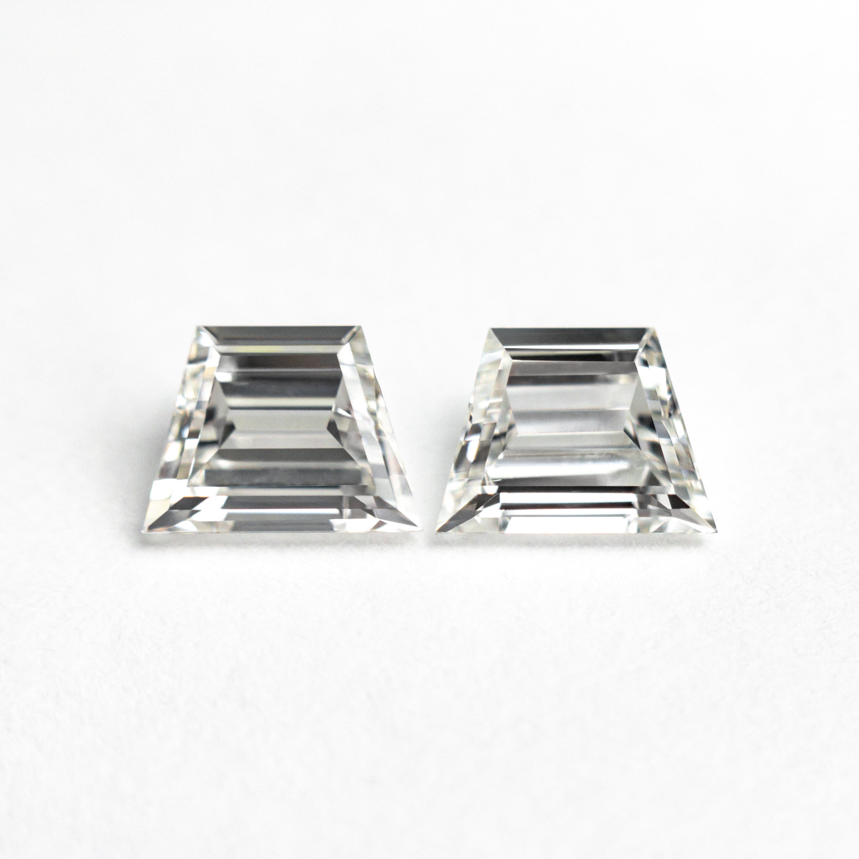 The 1.01cttw 2pc 5.73x4.28x2.53mm 5.83x4.31x2.37mm VVS H Trapezoid Step Cut Matching Pair 25532-01 by East London jeweller Rachel Boston | Discover our collections of unique and timeless engagement rings, wedding rings, and modern fine jewellery.