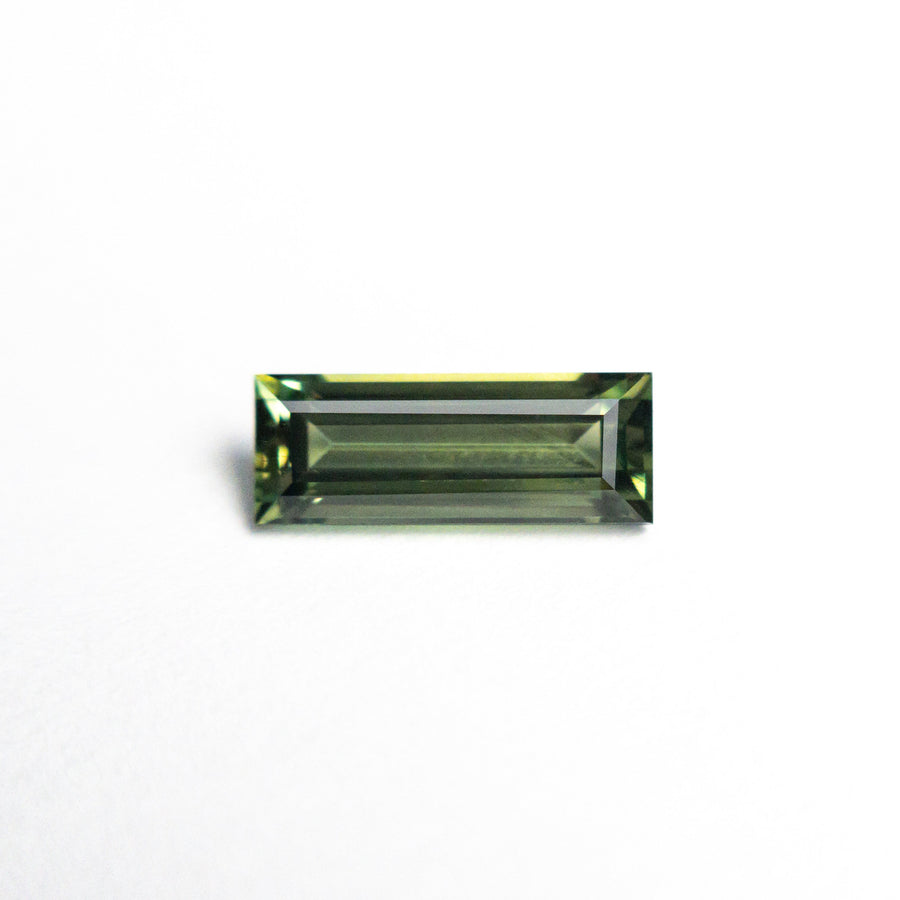 The 0.85ct 8.45x3.22x2.61mm Rectangle Step Cut Sapphire 25740-03 by East London jeweller Rachel Boston | Discover our collections of unique and timeless engagement rings, wedding rings, and modern fine jewellery. - Rachel Boston Jewellery