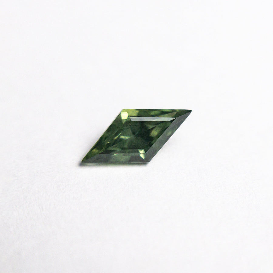 The 0.62ct 8.76x4.28x3.13mm Lozenge Step Cut Sapphire 25740-04 by East London jeweller Rachel Boston | Discover our collections of unique and timeless engagement rings, wedding rings, and modern fine jewellery. - Rachel Boston Jewellery