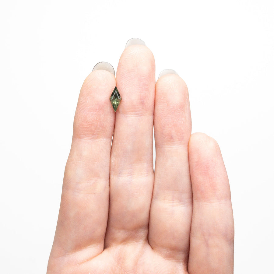 The 0.62ct 8.76x4.28x3.13mm Lozenge Step Cut Sapphire 25740-04 by East London jeweller Rachel Boston | Discover our collections of unique and timeless engagement rings, wedding rings, and modern fine jewellery. - Rachel Boston Jewellery