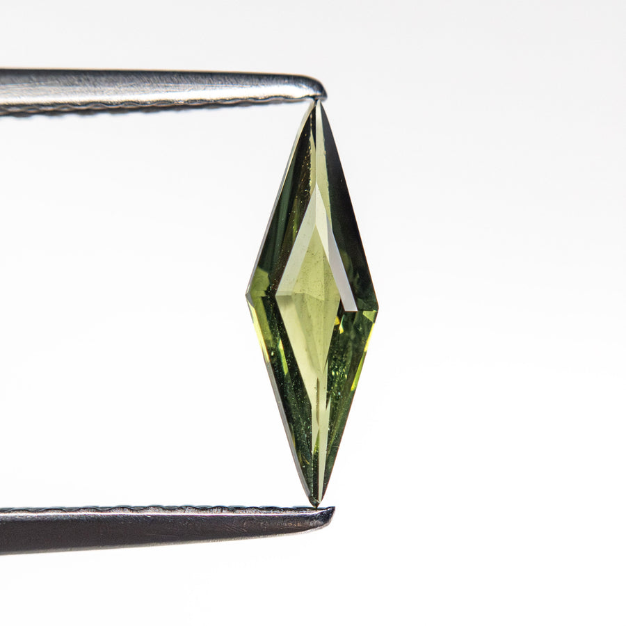The 0.42ct 10.83x3.44x1.76mm Lozenge Step Cut Sapphire 25740-19 by East London jeweller Rachel Boston | Discover our collections of unique and timeless engagement rings, wedding rings, and modern fine jewellery. - Rachel Boston Jewellery