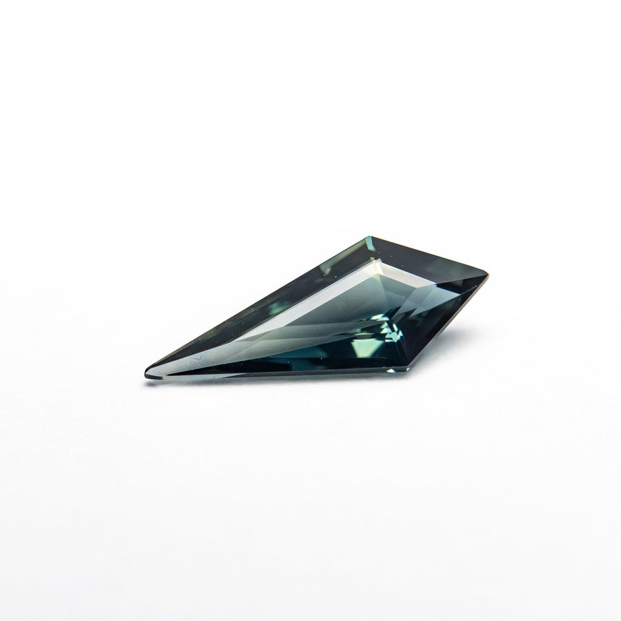 The 0.42ct 9.69x3.83x2.16mm Kite Step Cut Sapphire 25740-21 by East London jeweller Rachel Boston | Discover our collections of unique and timeless engagement rings, wedding rings, and modern fine jewellery. - Rachel Boston Jewellery