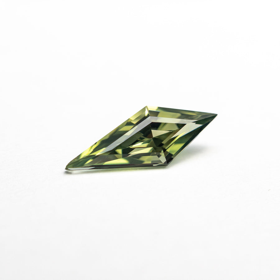The 0.51ct 9.76x3.78x2.66mm Kite Step Cut Sapphire 25740-22 by East London jeweller Rachel Boston | Discover our collections of unique and timeless engagement rings, wedding rings, and modern fine jewellery. - Rachel Boston Jewellery